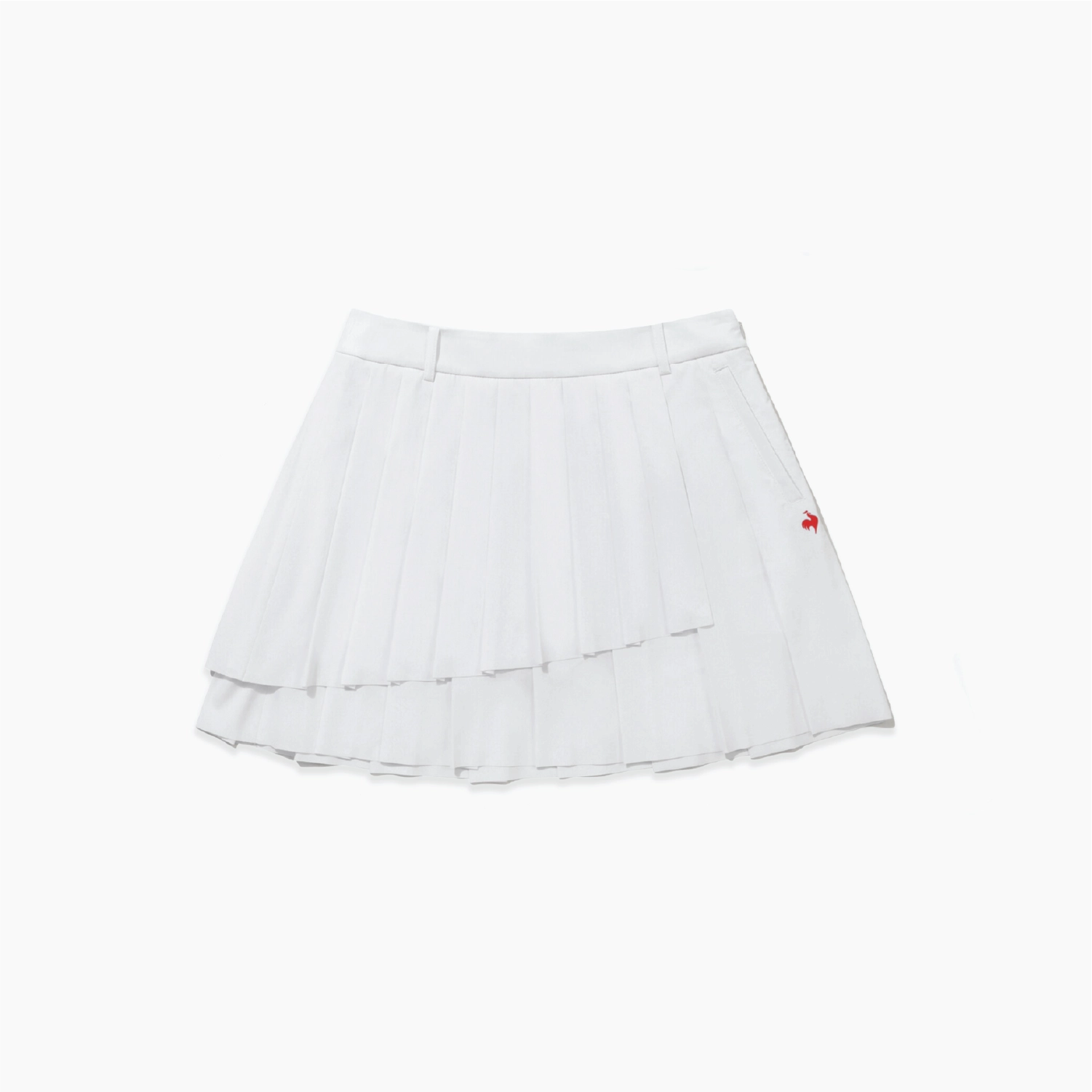 A white pleated tennis skirt with a small red embroidered logo on the side, displayed against a clean white background.