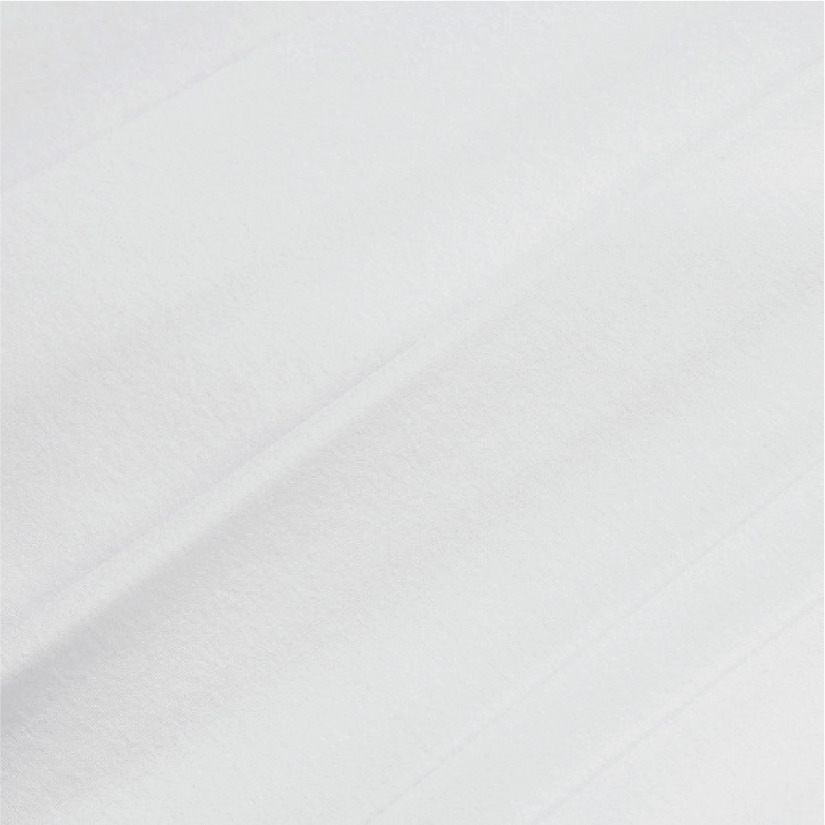 A close-up of a white textured fabric with soft diagonal folds and a fine woven texture.