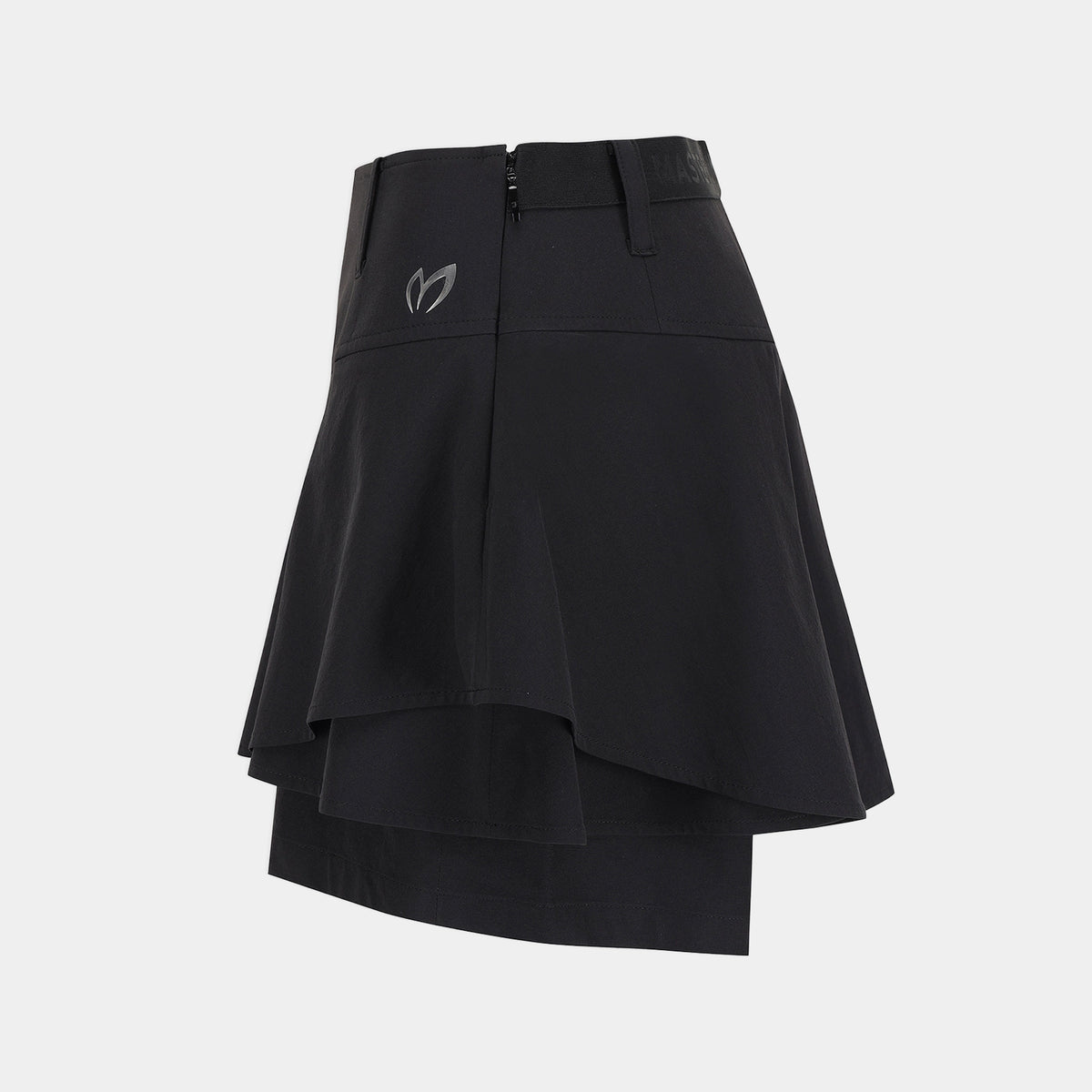 A black athletic skirt with a layered, asymmetrical ruffle design and a small gray logo on the left hip, shown against a light gray background.