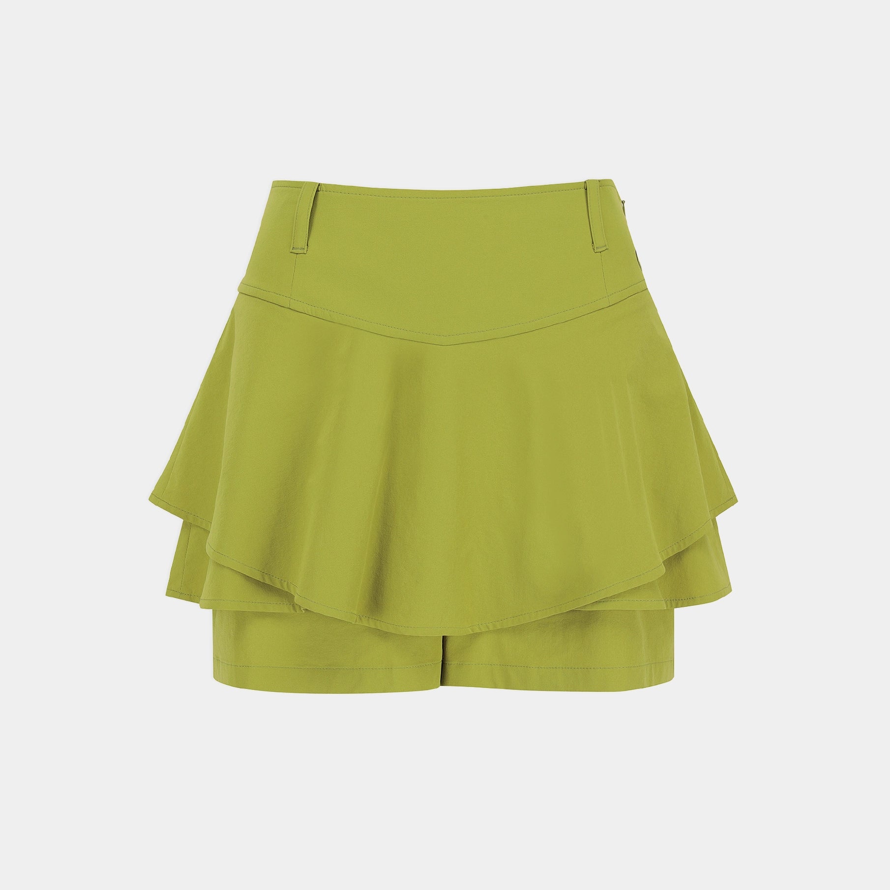 A lime green tiered ruffle mini skirt with matching shorts underneath, shown flat against a light gray background.