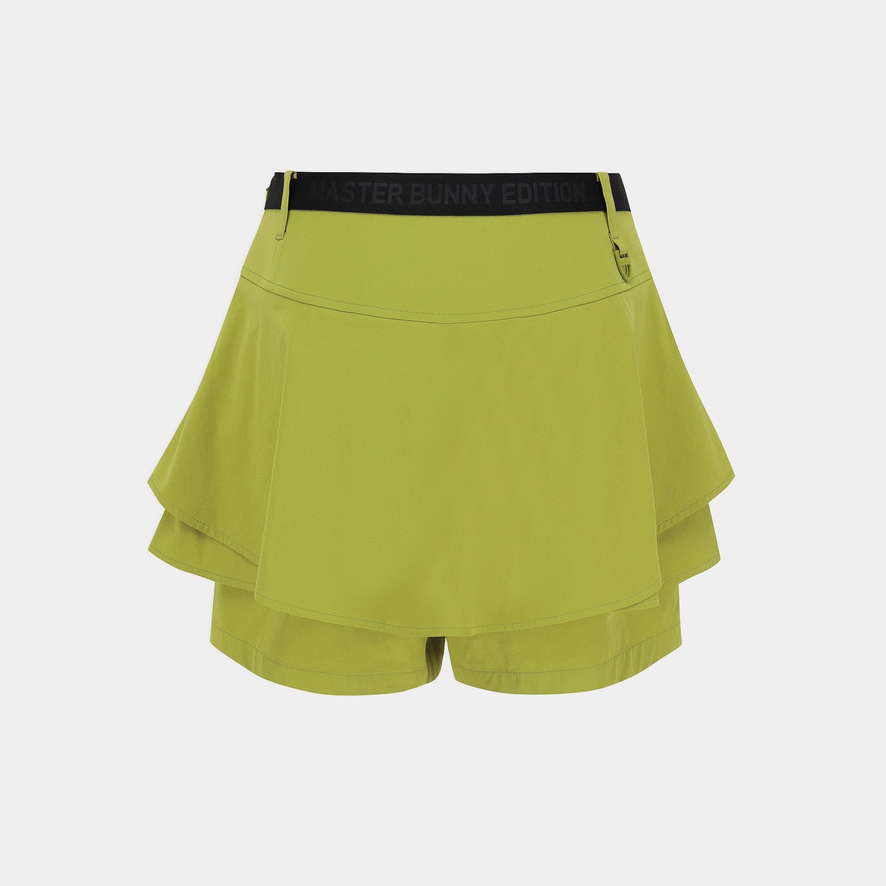 A lime green athletic skirt with a black elastic waistband featuring the text 'MISTER BUNNY EDITION' in black, shown against a light gray background.