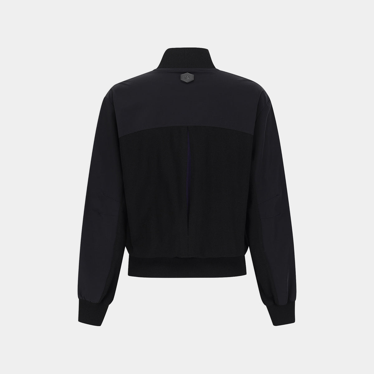 A black color-blocked bomber jacket with a mock neck, ribbed hem and cuffs, shown from the back on a light gray background.