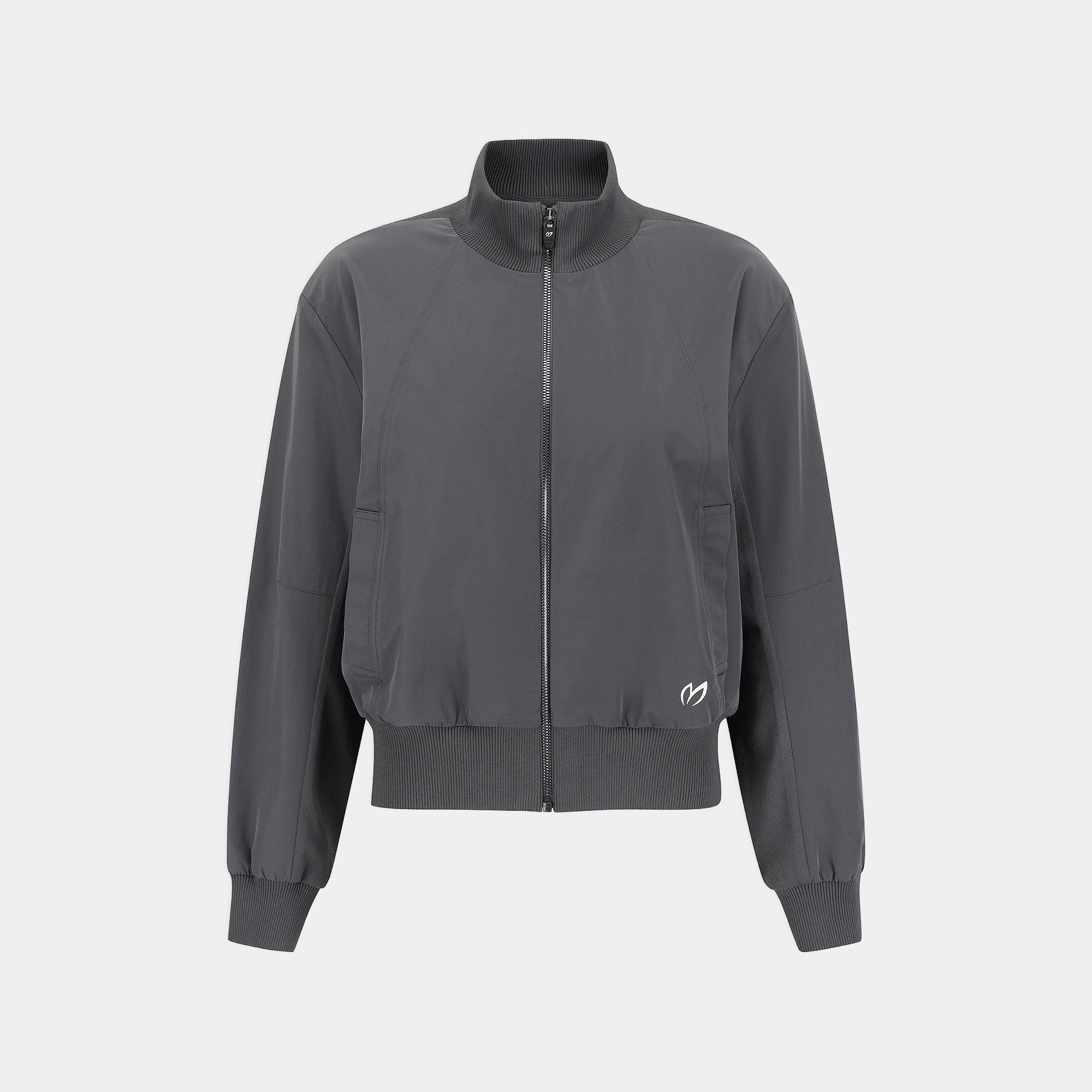 A dark gray zip-up jacket with a stand collar, ribbed cuffs and hem, and a small white logo on the lower left front, shown against a light gray background.