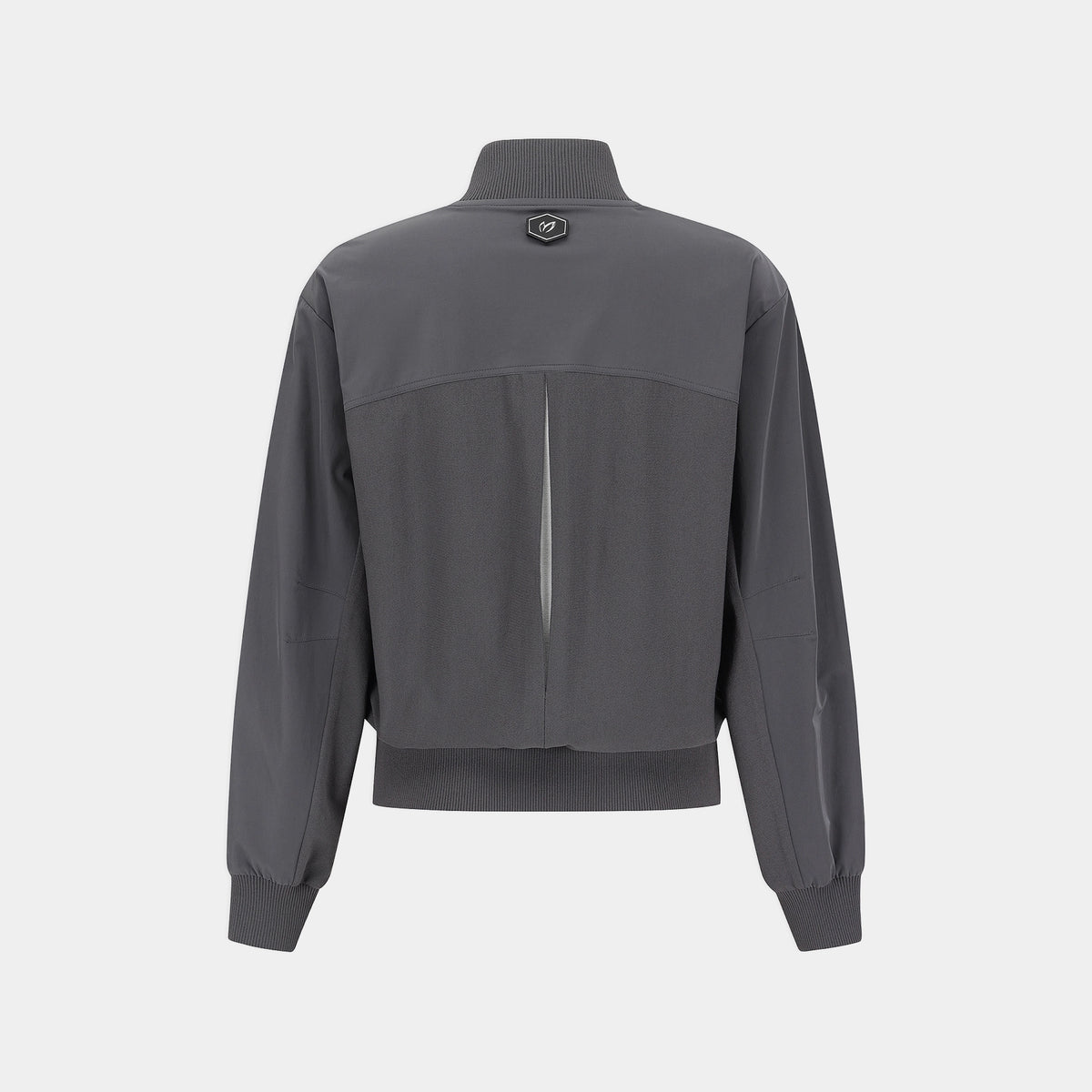 A dark gray athletic jacket shown from the back, featuring a high mock neck, a vertical zip closure, and ribbed cuffs and hem, displayed on a light gray background.