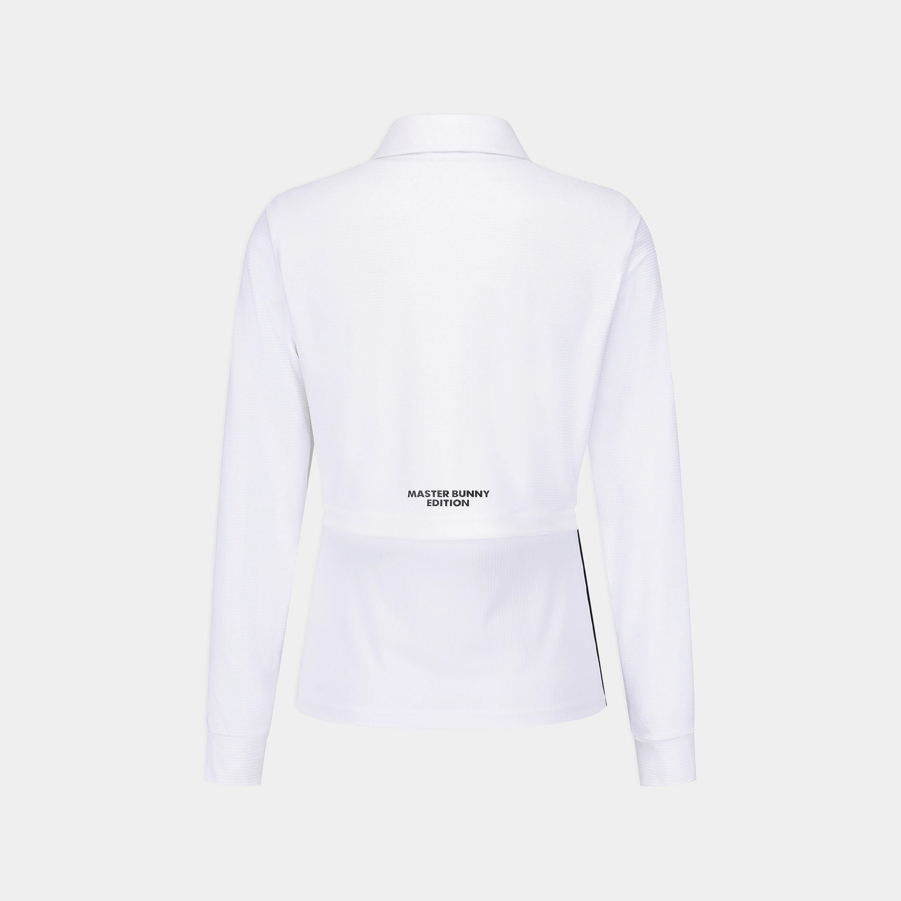 White long-sleeve collared shirt shown from the back, featuring a small black 'MASTER BUNNY EDITION' logo near the lower back and a thin black side stripe, on a light gray background.
