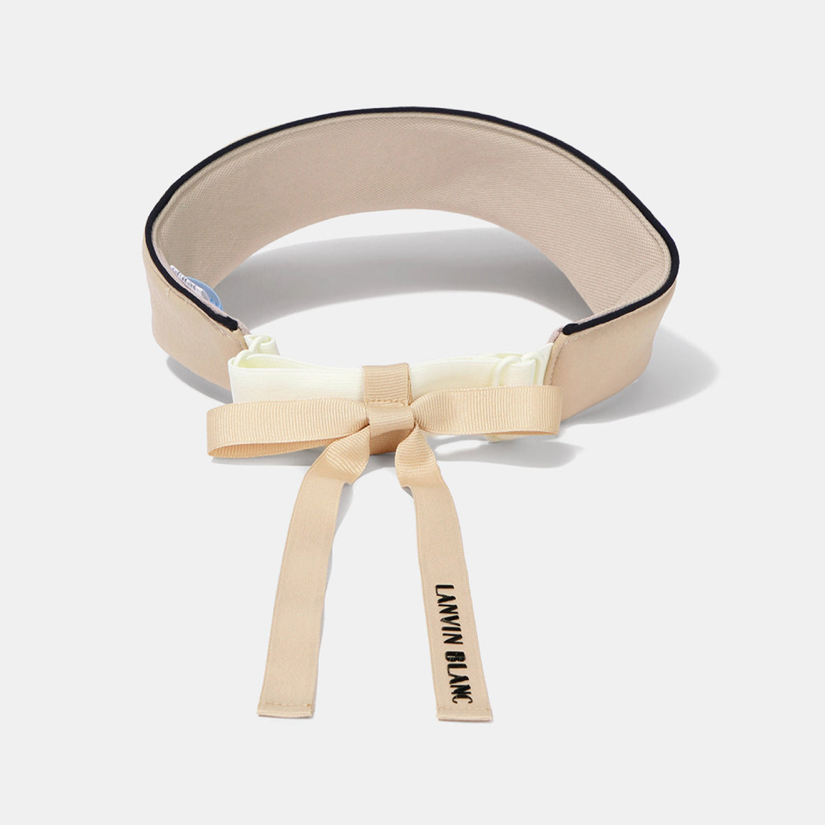 A beige waist trainer belt with a black trim, featuring a matching beige ribbon bow at the front and a hanging tag that reads 'LANVIN BLANC'.