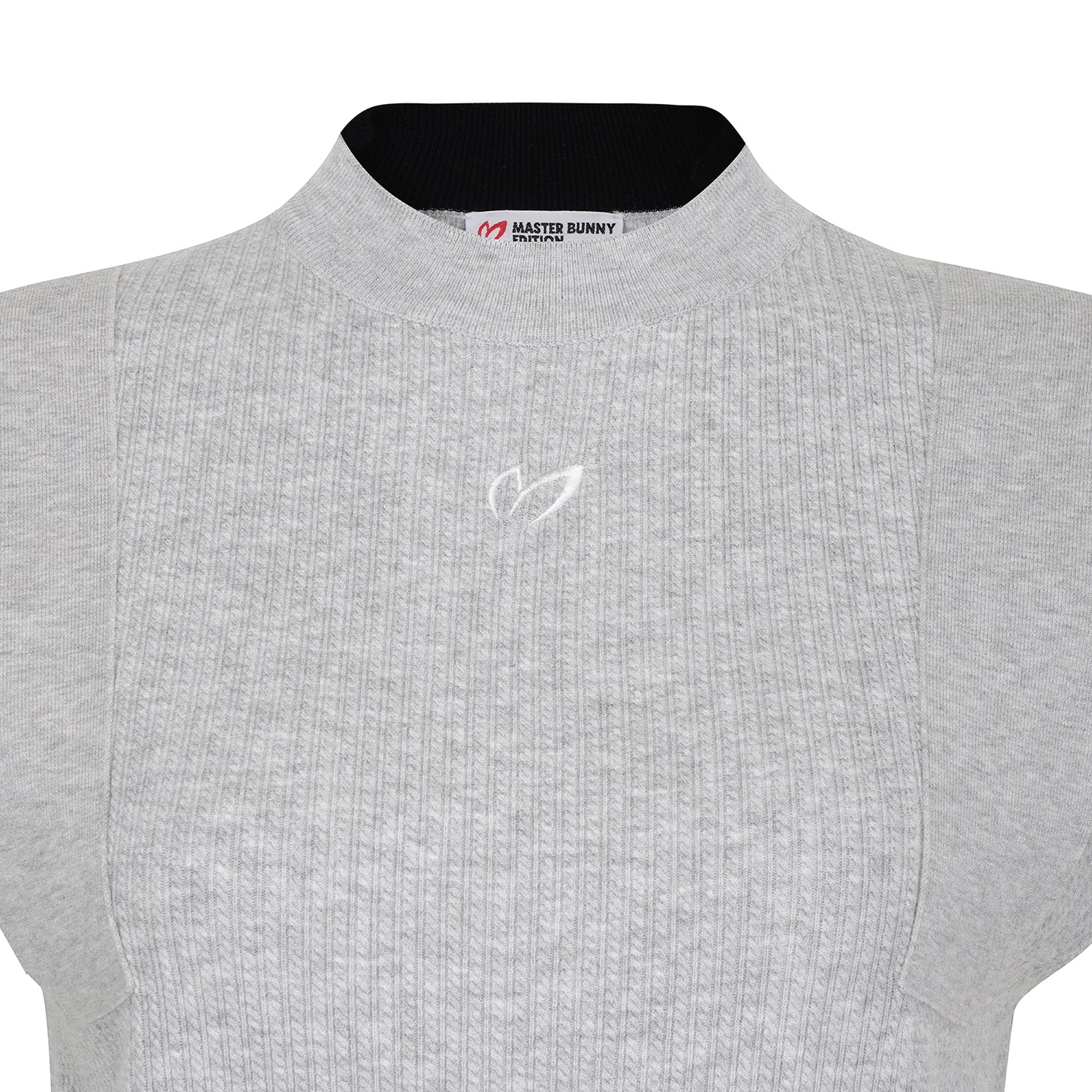 Close-up of a light gray ribbed knit top with a black inner collar and a small white embroidered logo on the chest. The neck label reads Master Bunny.