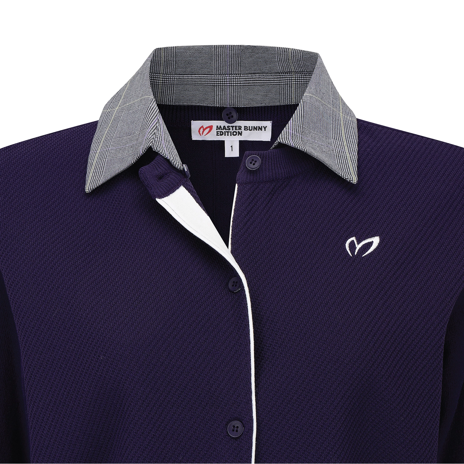 A close-up of a polo shirt collar area showing a dark purple textured body, a gray plaid inner collar, a white plaid outer collar, and a white embroidered logo on the chest.