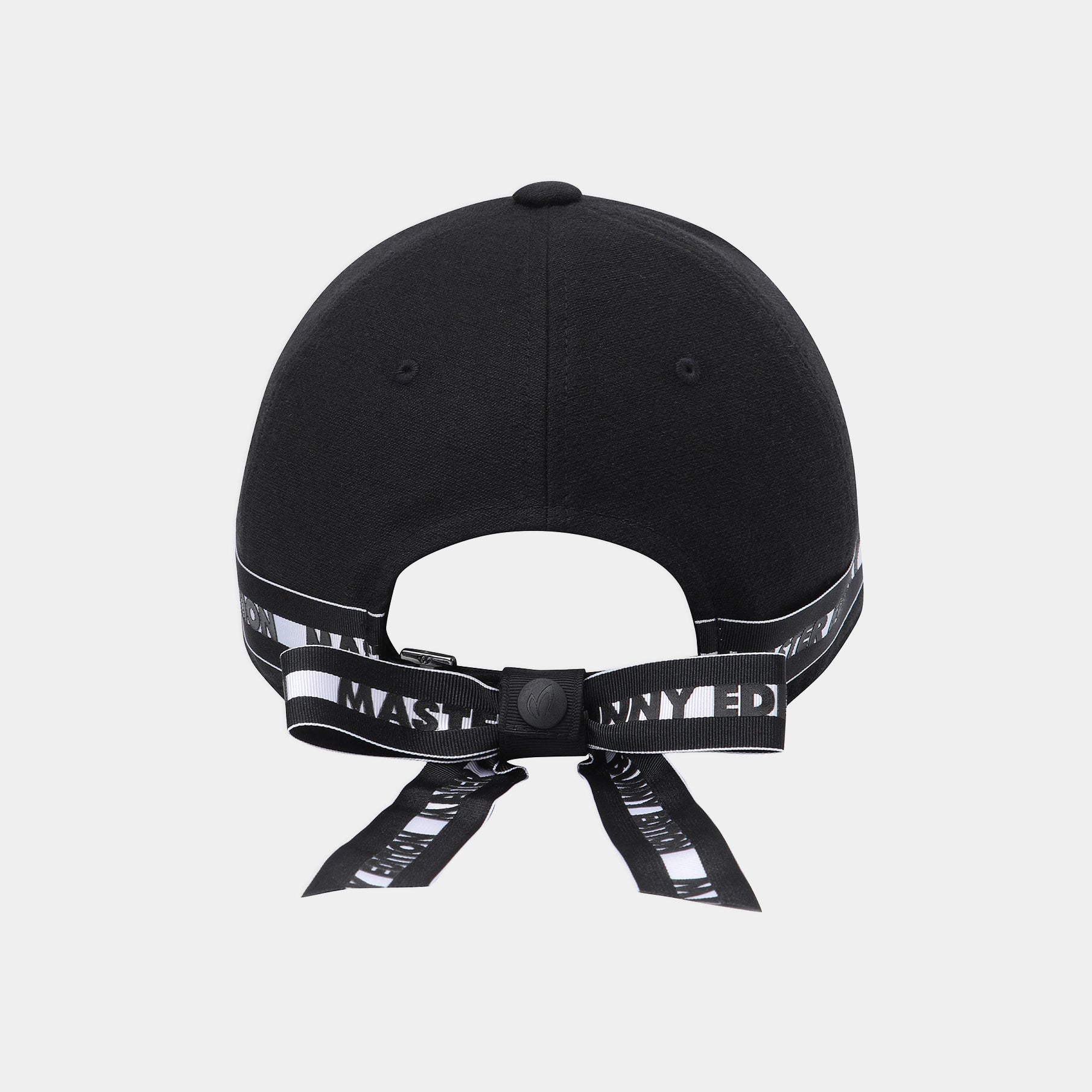 Black baseball cap shown from the back, featuring a black adjustable strap with white text and a black snap closure, photographed on a light gray background.