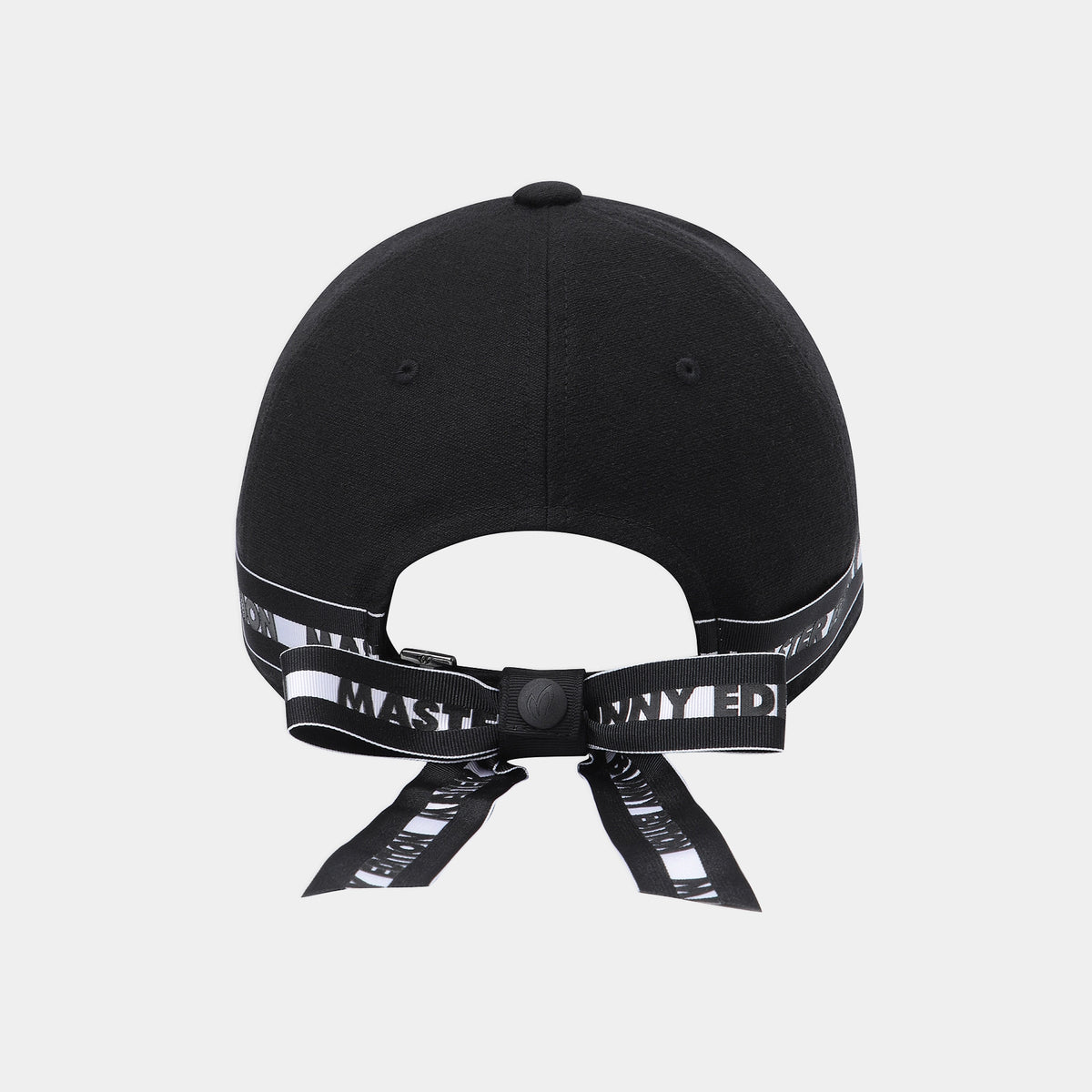 Black baseball cap shown from the back, featuring a black adjustable strap with white text and a black snap closure, photographed on a light gray background.