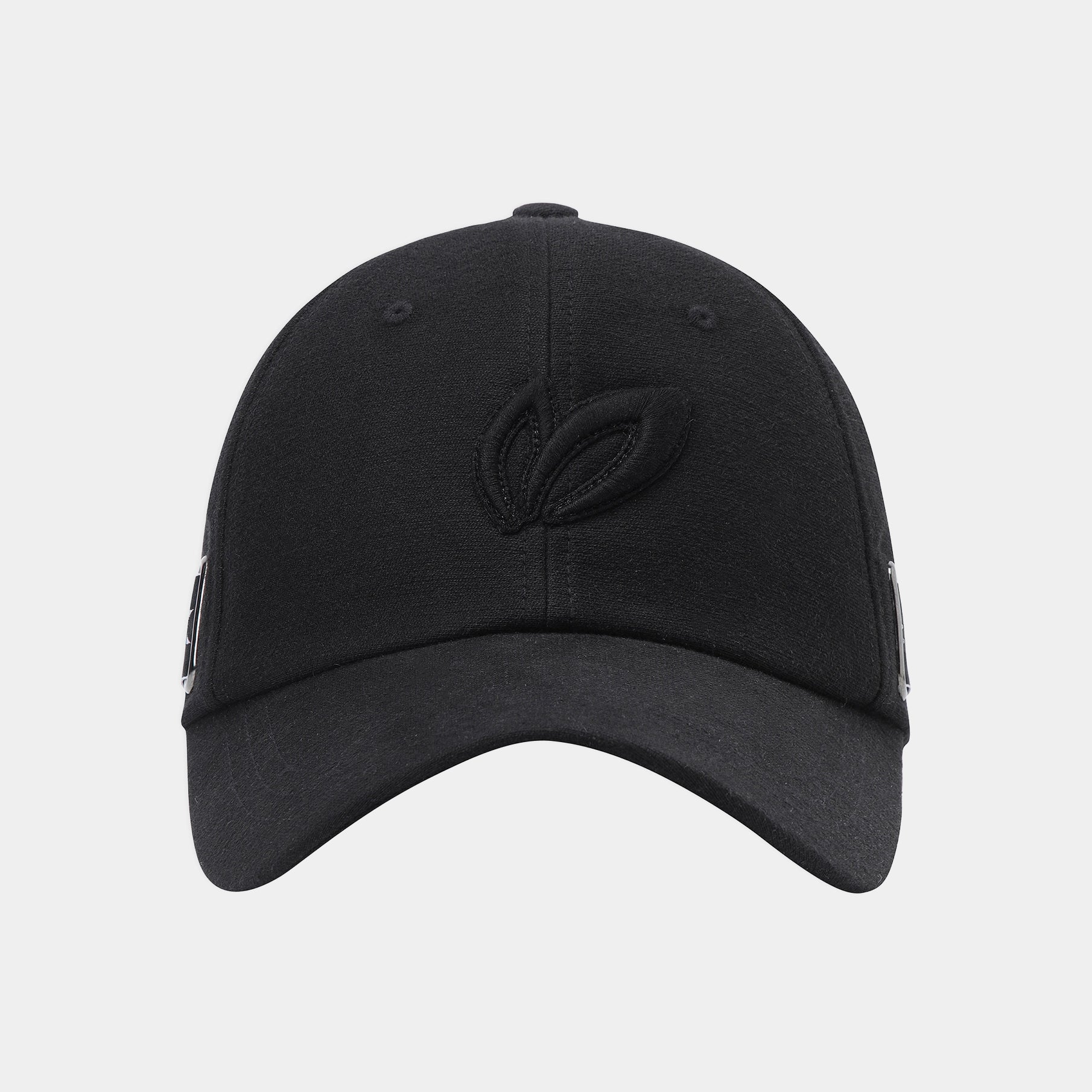 A black baseball cap with a tonal embroidered leaf logo on the front, shown against a light gray background.