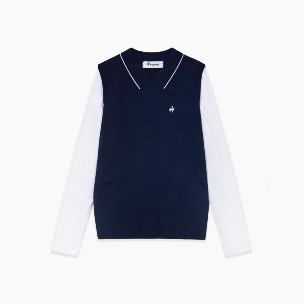 A navy blue knit sweater vest layered over a white long-sleeve collared shirt, featuring a small white embroidered rooster logo on the left chest. 