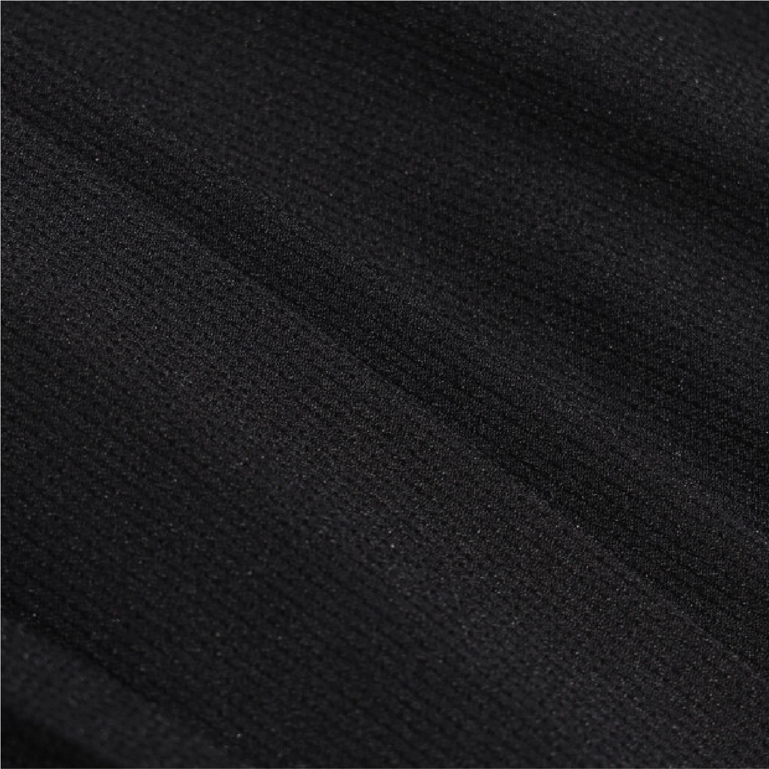 A close-up of black textured fabric with a fine ribbed or woven surface and soft diagonal folds.
