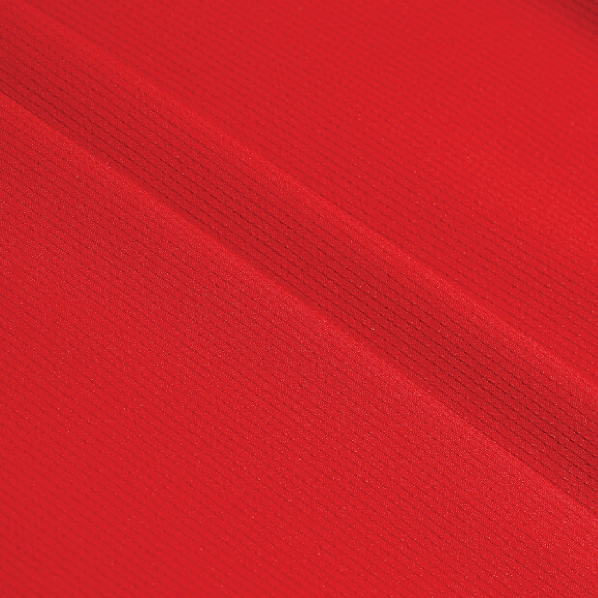 A close-up of bright red textured fabric with a diagonal ribbed pattern.