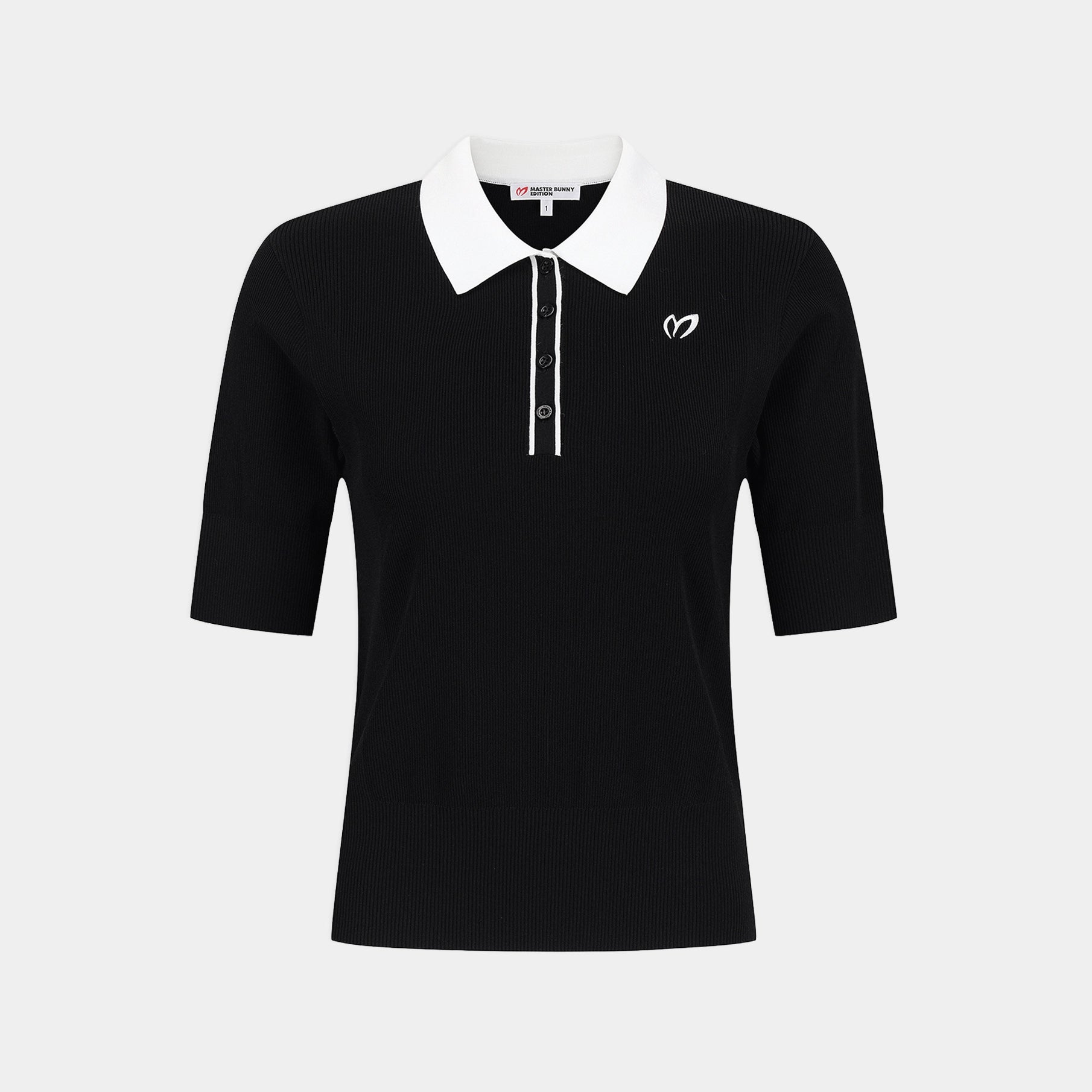 A black short-sleeve polo shirt with a contrasting white collar and white button placket, featuring a small white embroidered logo on the left chest, displayed on a light gray background.