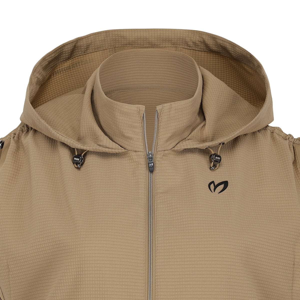Close-up of a hooded jacket in a warm tan/khaki color, featuring a full-zip front, a stand-up collar, and a small black logo on the left chest.