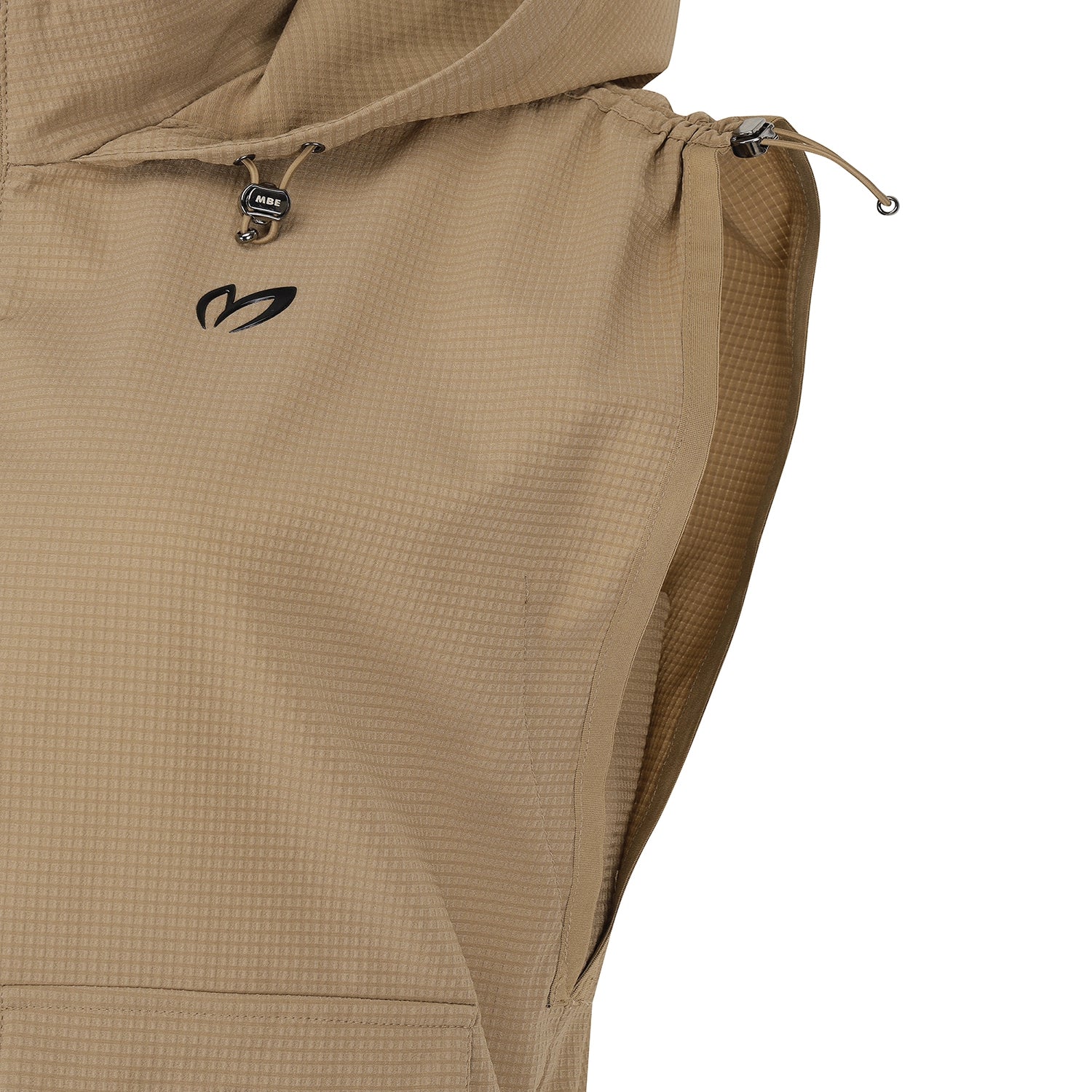 Close-up of a hooded jacket in a warm tan color, showing the hood drawstring, a black stylized logo on the chest, and the textured fabric against a white background.