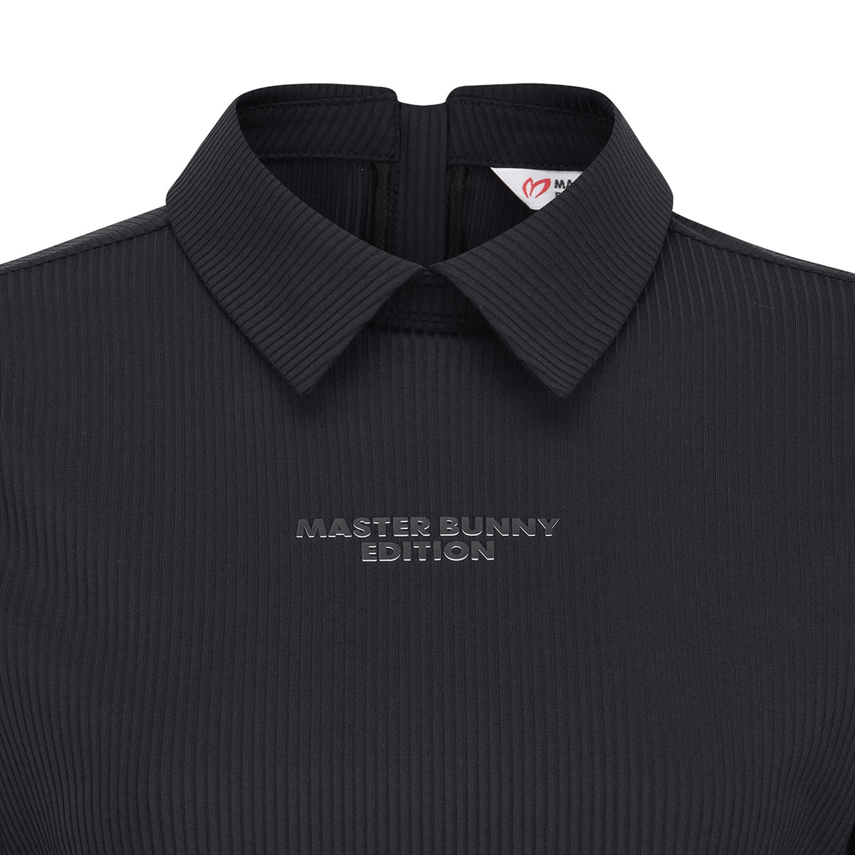 Close-up of a dark charcoal ribbed knit polo shirt with a collar, featuring the text 'MASTER BUNNY EDITION' embroidered on the chest.