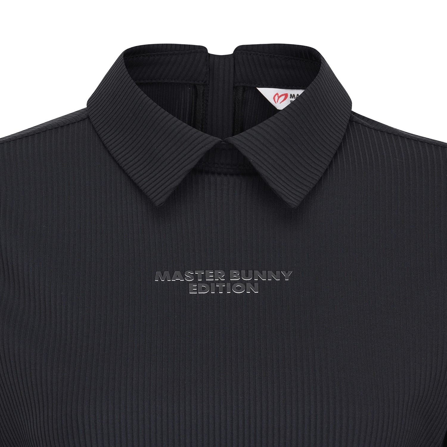 Close-up of a dark charcoal ribbed knit polo shirt with a collar, featuring the text 'MASTER BUNNY EDITION' embroidered on the chest.