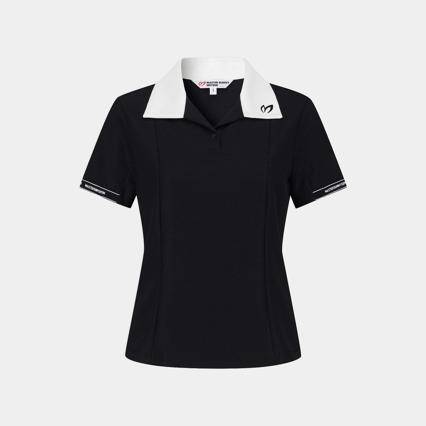 A black short-sleeve polo shirt with a contrasting white collar, featuring a small white heart logo on the left chest and white trim on the sleeve cuffs, shown against a light gray background.