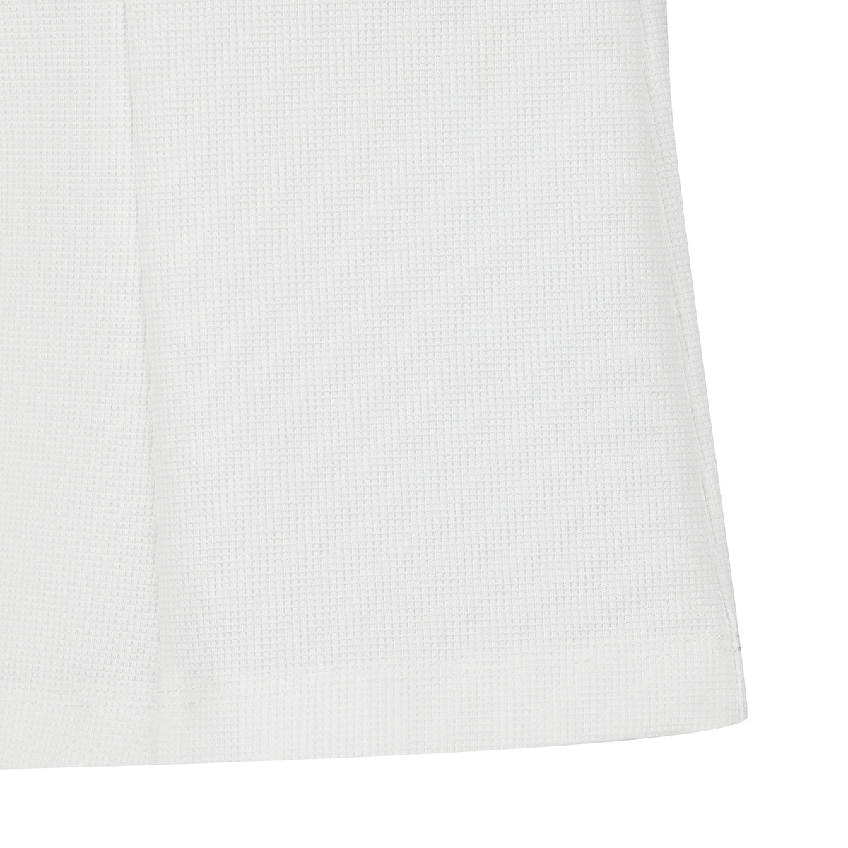 Close-up of a white textured fabric surface with a subtle woven pattern and a hemmed edge, shown against a white background.