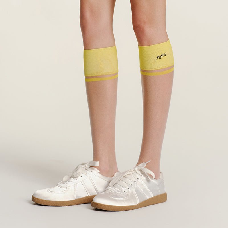 Keypote Women's Yellow Knee High Golf Sock on Model | Erthe Golf