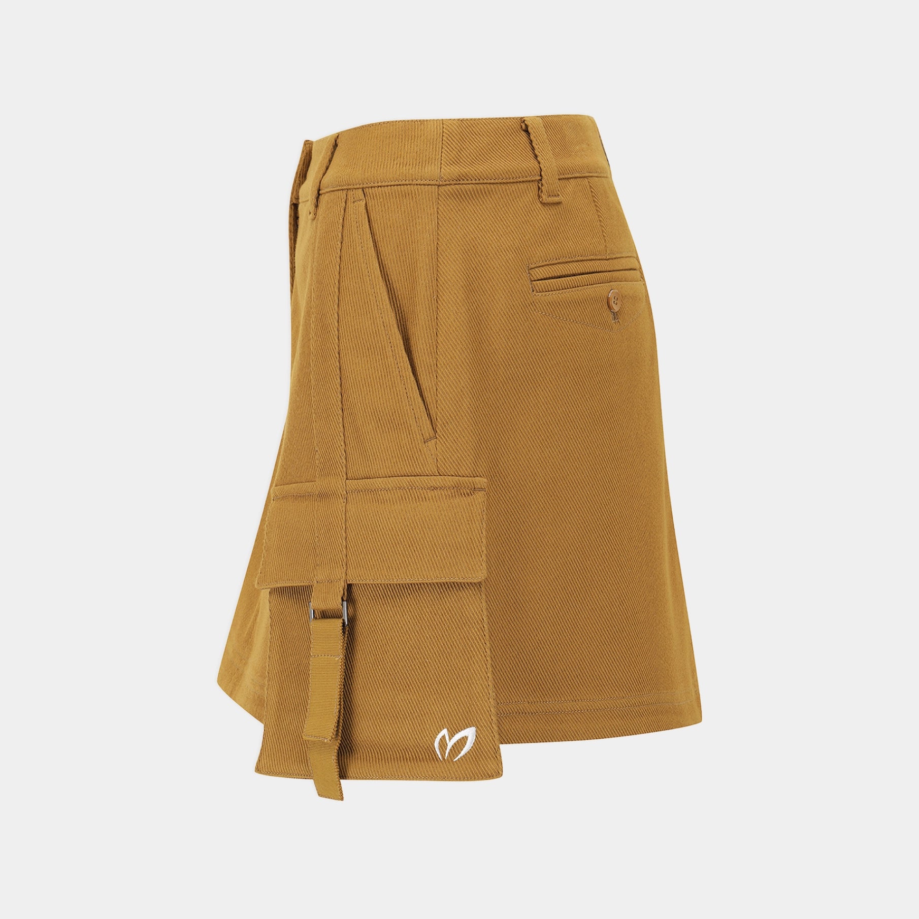 A mustard yellow asymmetrical skirt with multiple cargo pockets and a small white logo on the lower front, displayed against a light gray background.