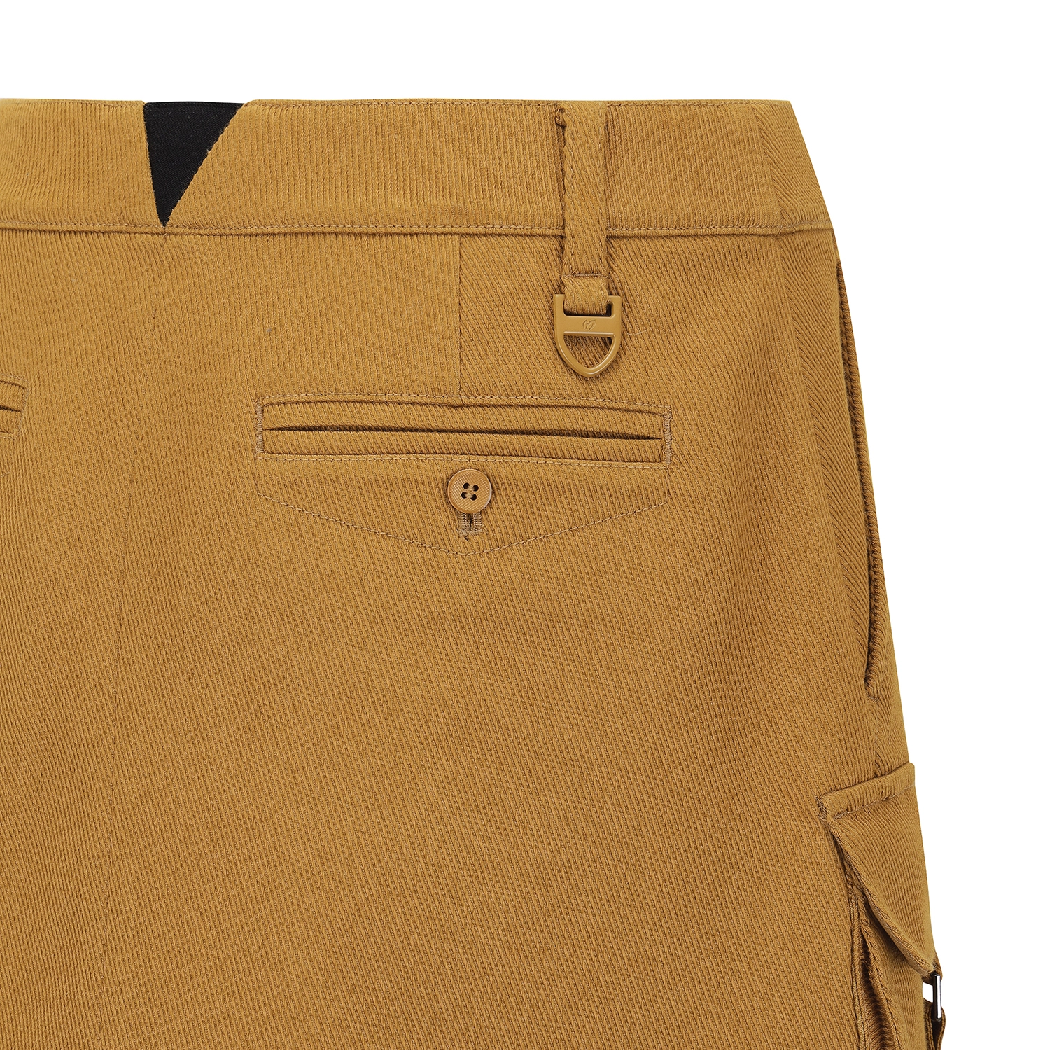 Close-up of the back waistband and pocket details of a pair of mustard yellow corduroy trousers, showing a buttoned welt pocket, belt loop, and side cargo pocket.