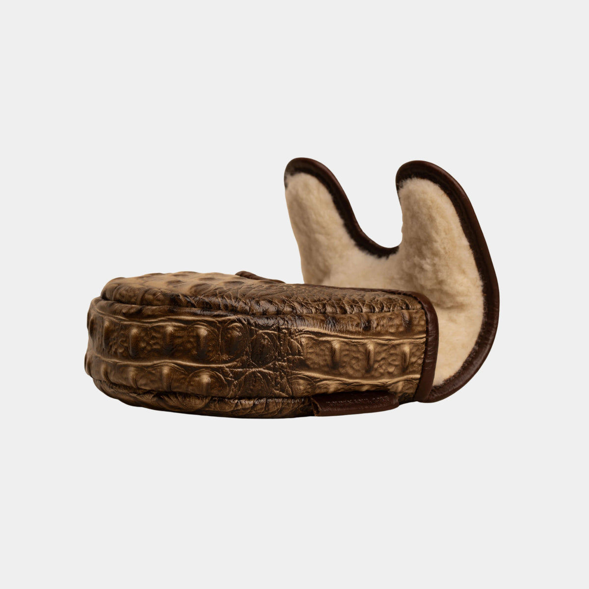 A crocodile-embossed brown leather center df3 putter cover with a cream-colored shearling lining, shown from a side profile view against a light gray background.