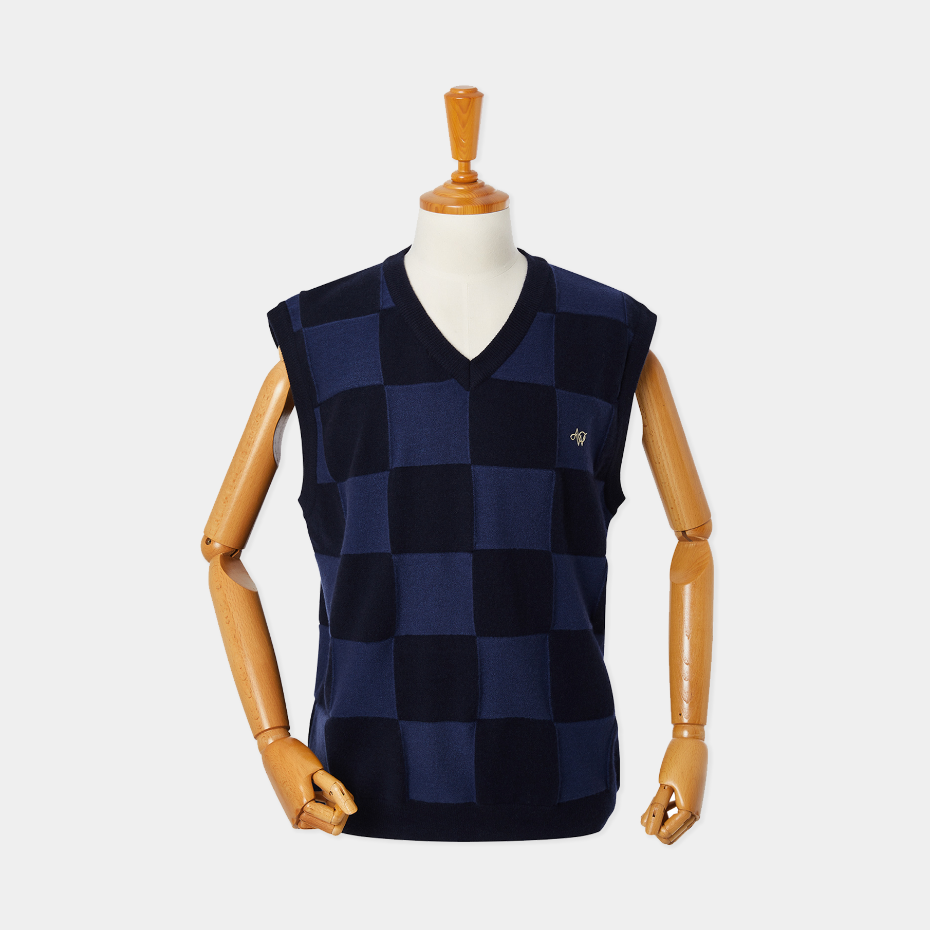 Navy checkered vest on a mannequin against a white background