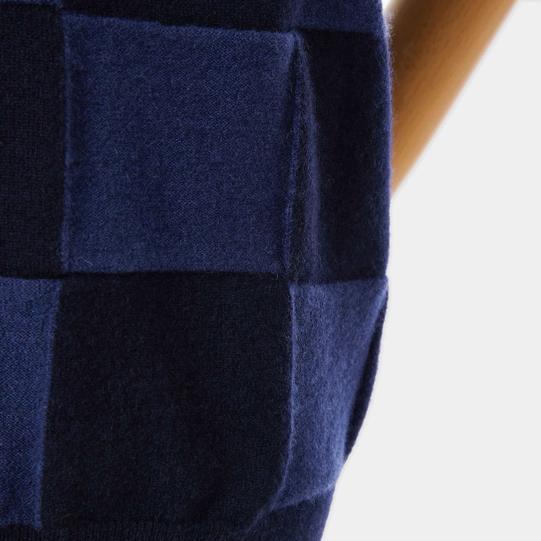 Navy blue fabric with a checkered pattern on a white background