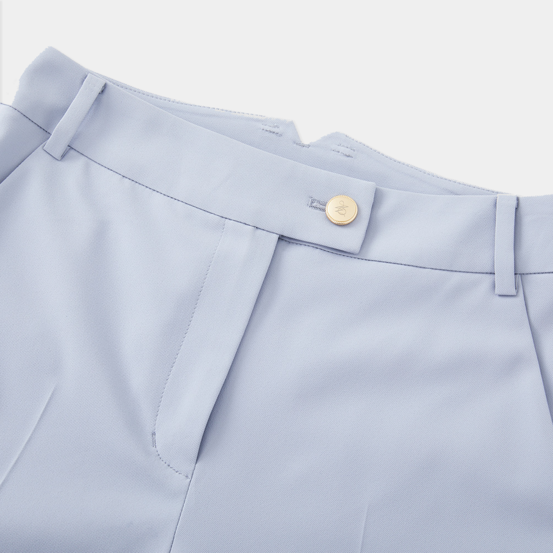Light blue pants with a button on a white background