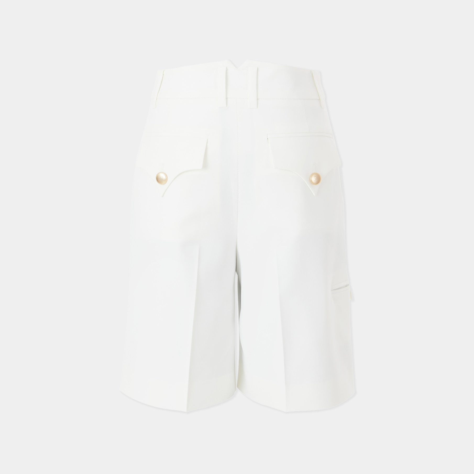 White shorts with gold buttons on a white background