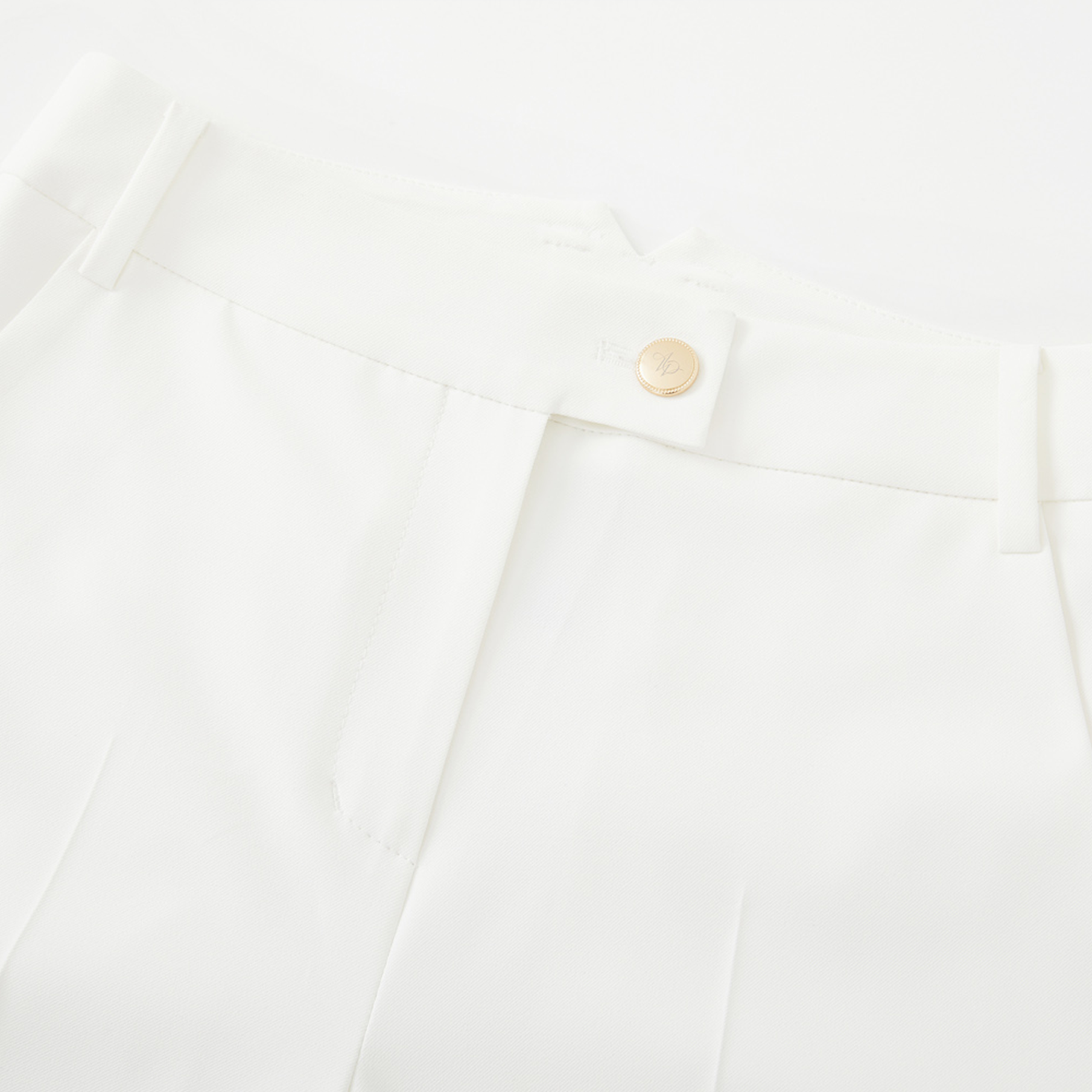 Close-up of a white short pocket with a button on a white background