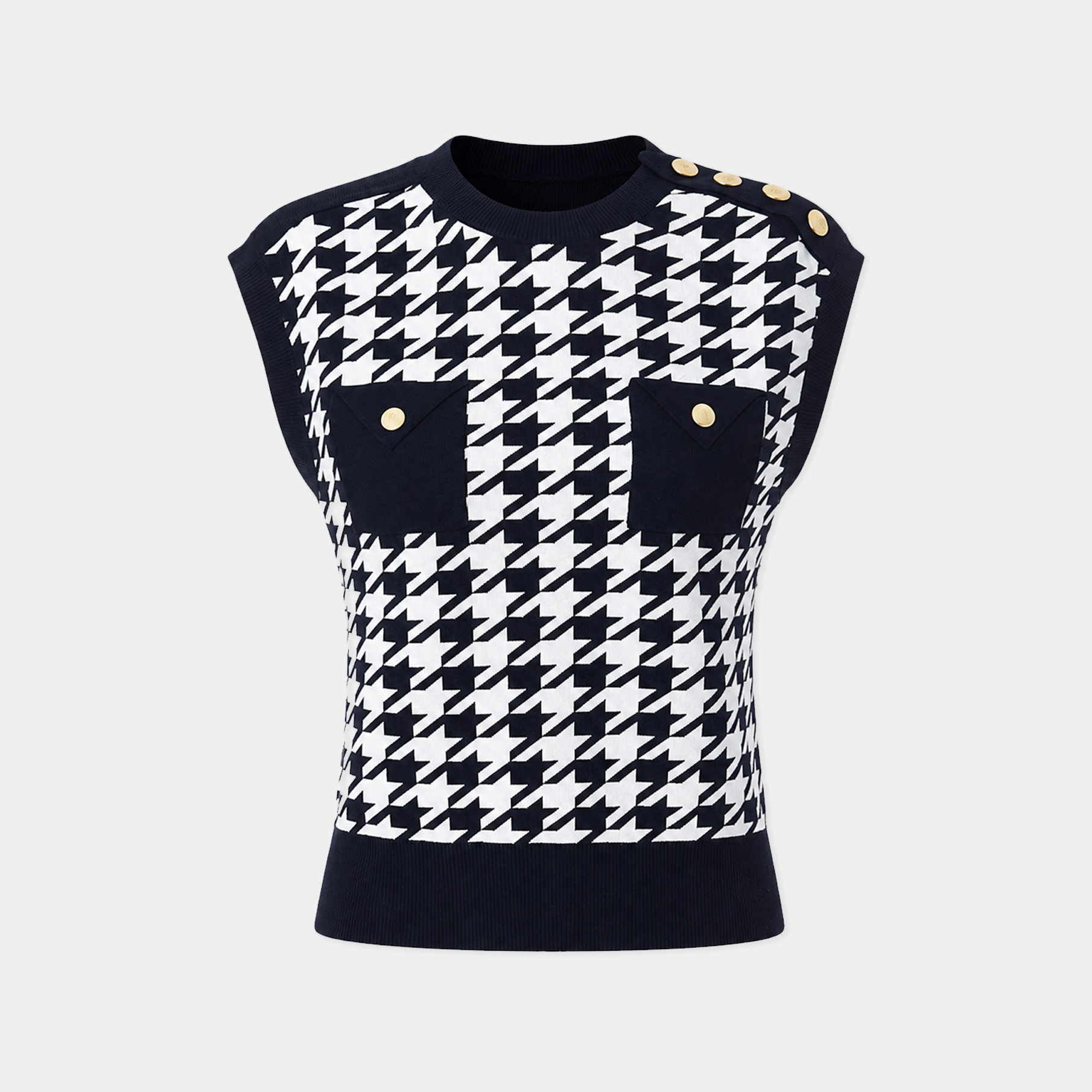 Black and white houndstooth patterned sleeveless top with button details on a light gray background
