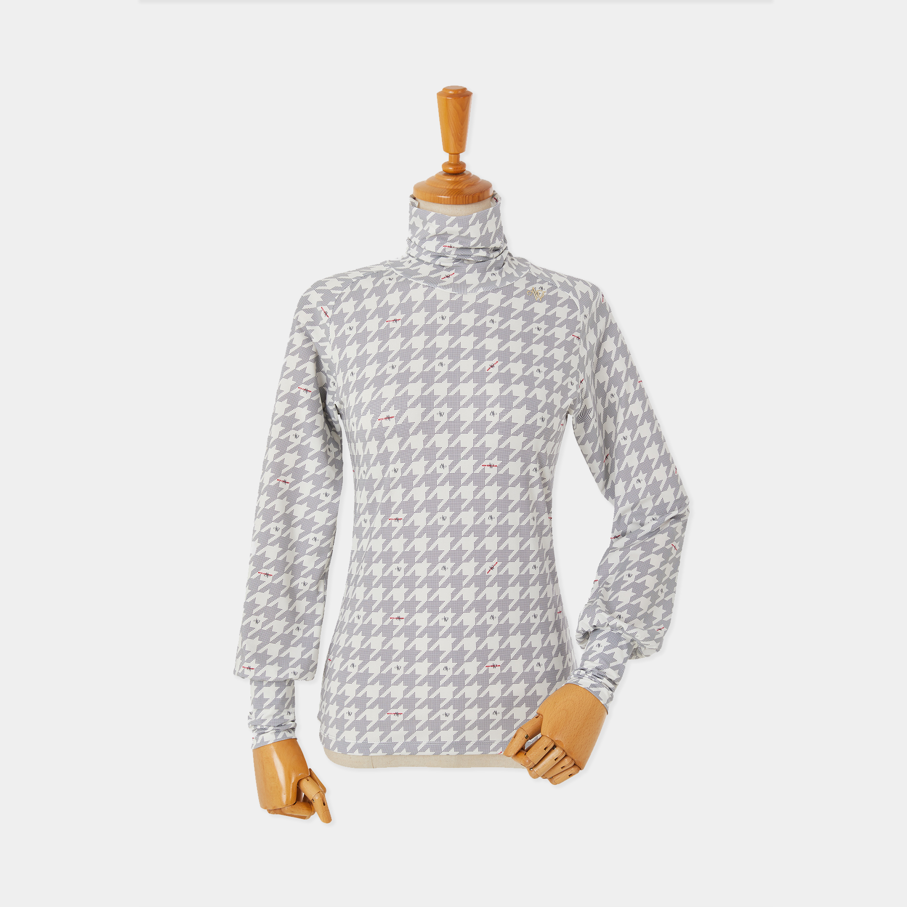 Gray patterned long-sleeve shirt on a mannequin against a white background