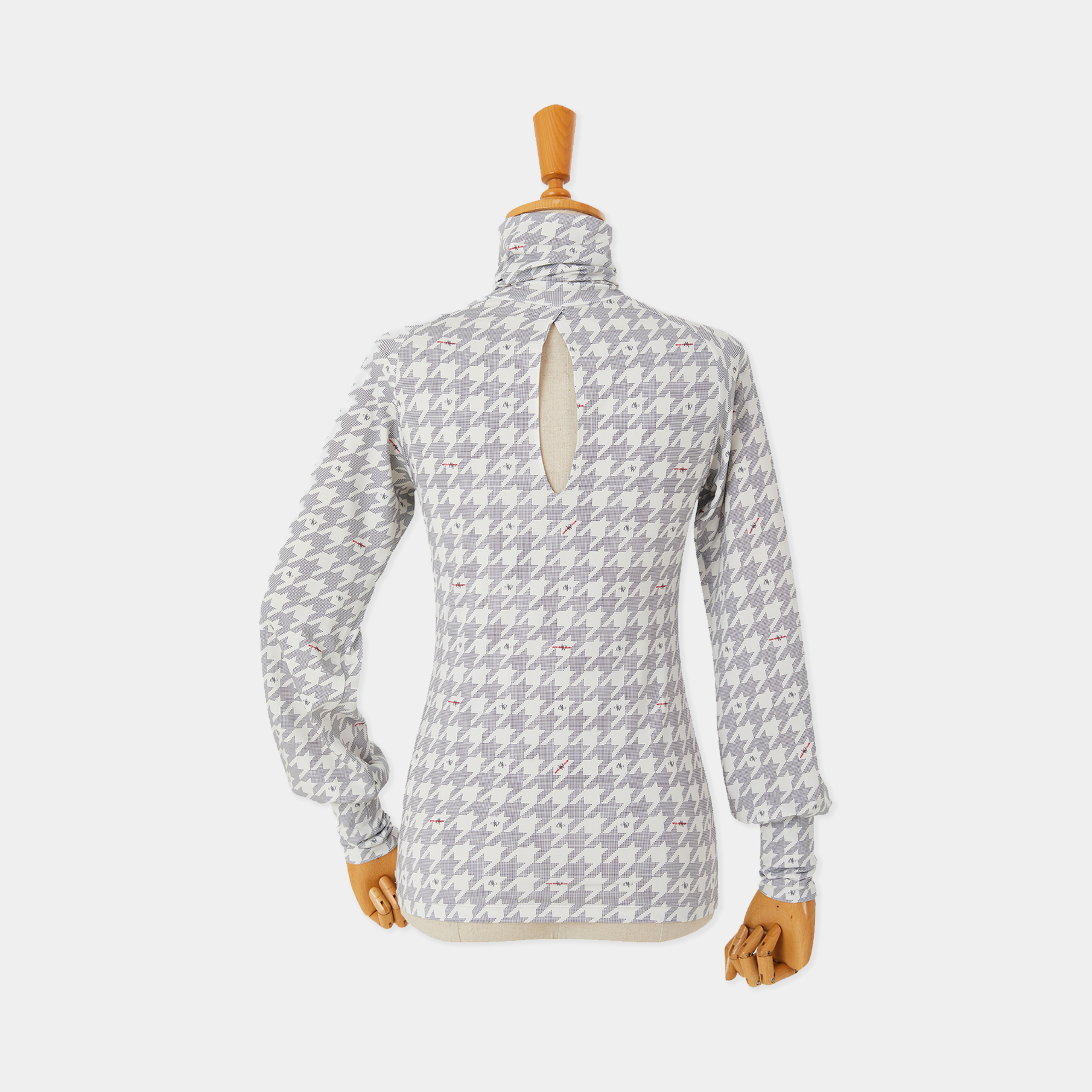 Patterned long-sleeve shirt on a mannequin against a white background