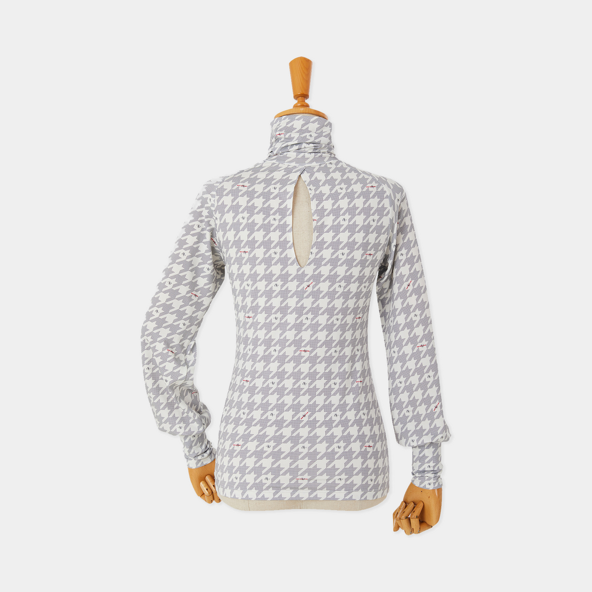 Patterned long-sleeve shirt on a mannequin against a white background