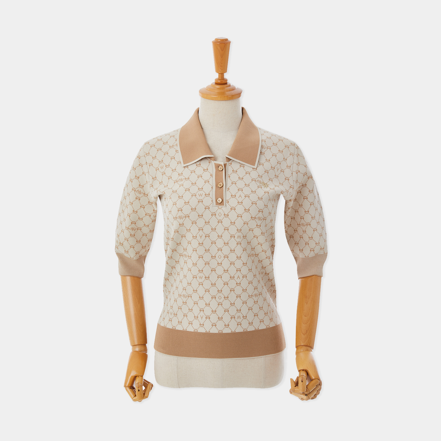Beige patterned shirt on a mannequin against a white background
