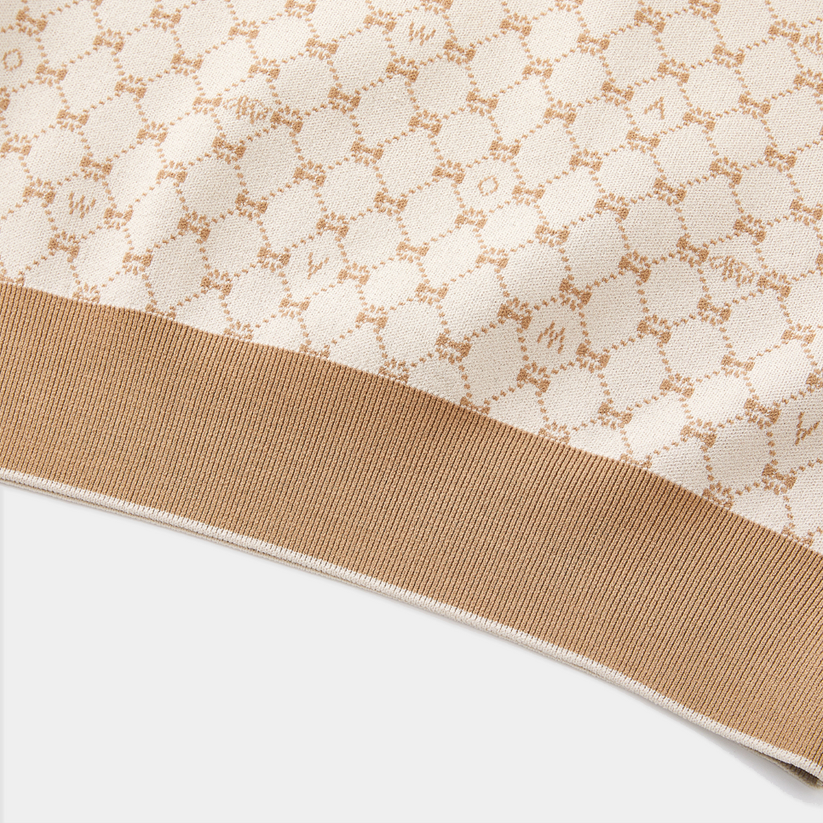Close-up of a fabric with a subtle pattern on a white background