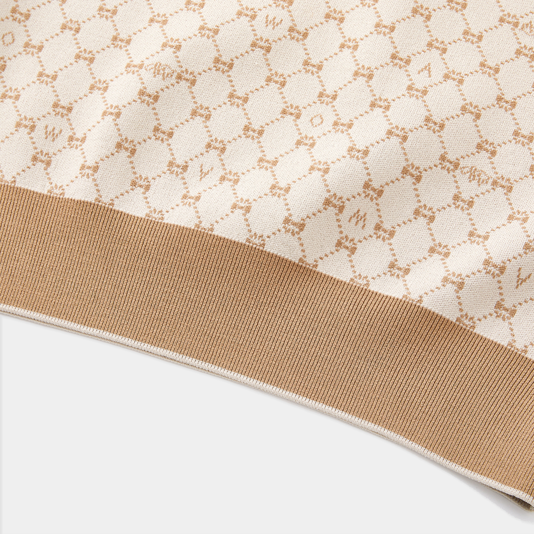 Close-up of a fabric with a subtle pattern on a white background
