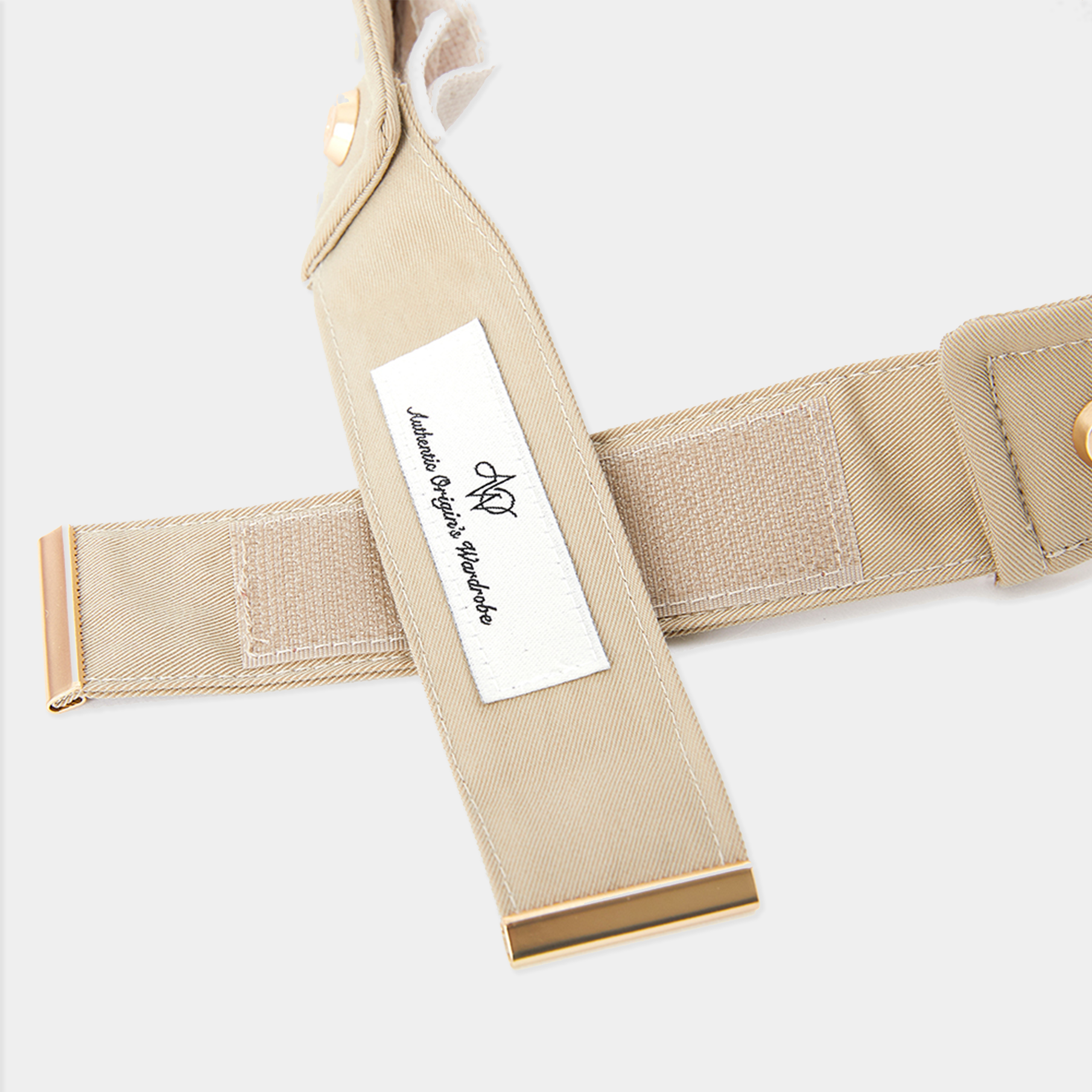 Beige belt with a label on a light gray background