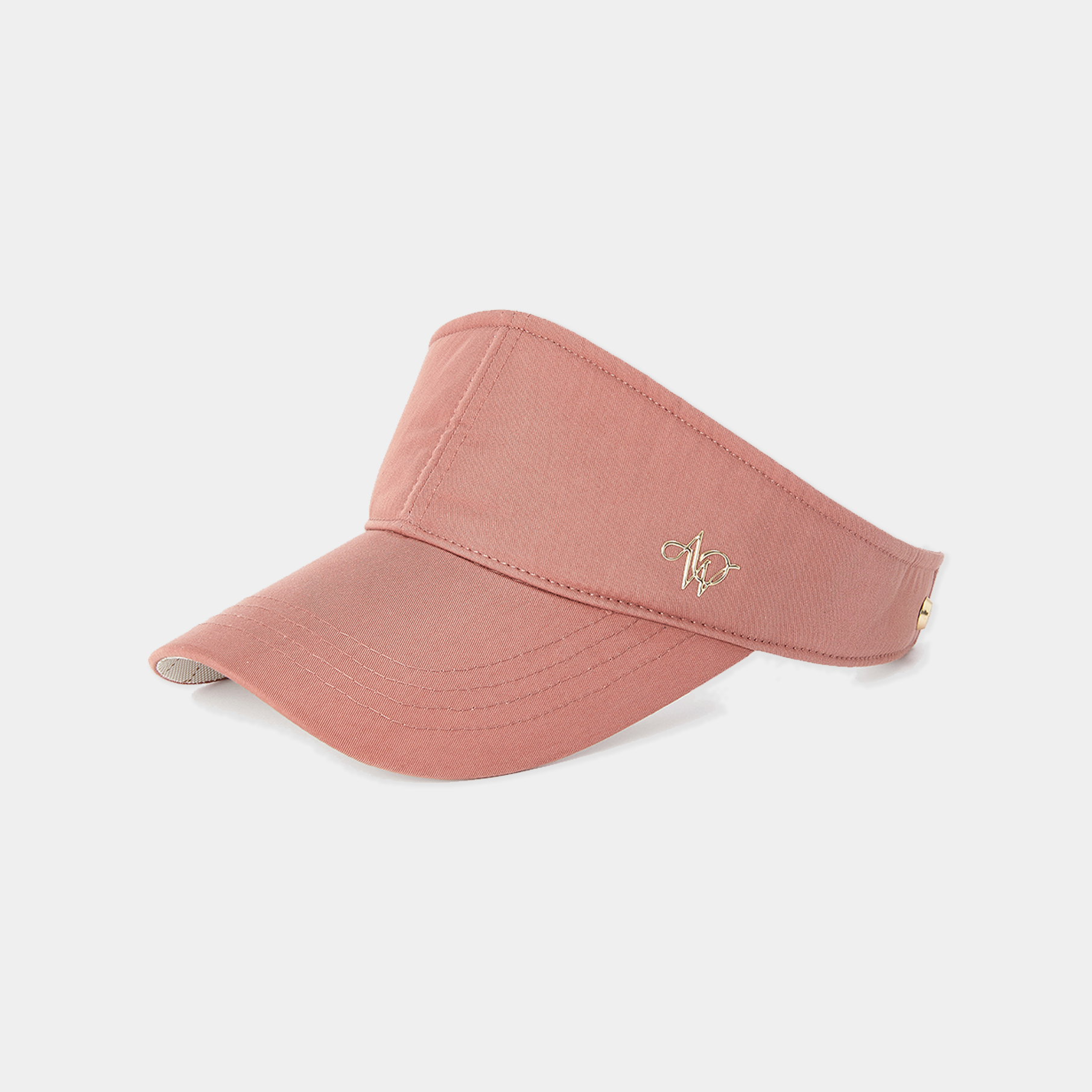 Pink visor cap with a logo on a light gray background