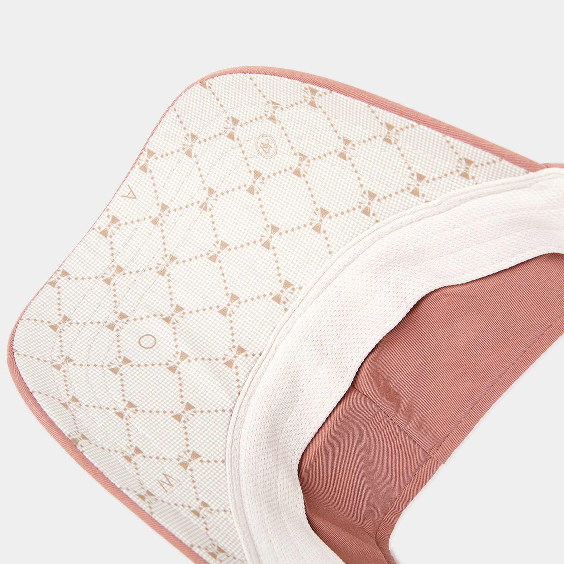 Close-up of a textured fabric with a geometric pattern on a white background