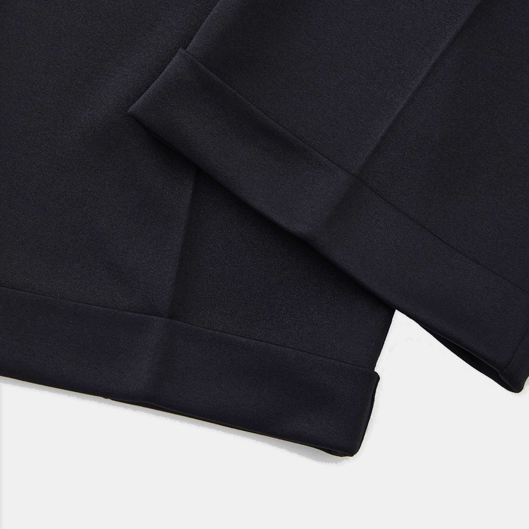 Close-up of a black fabric texture on a white background