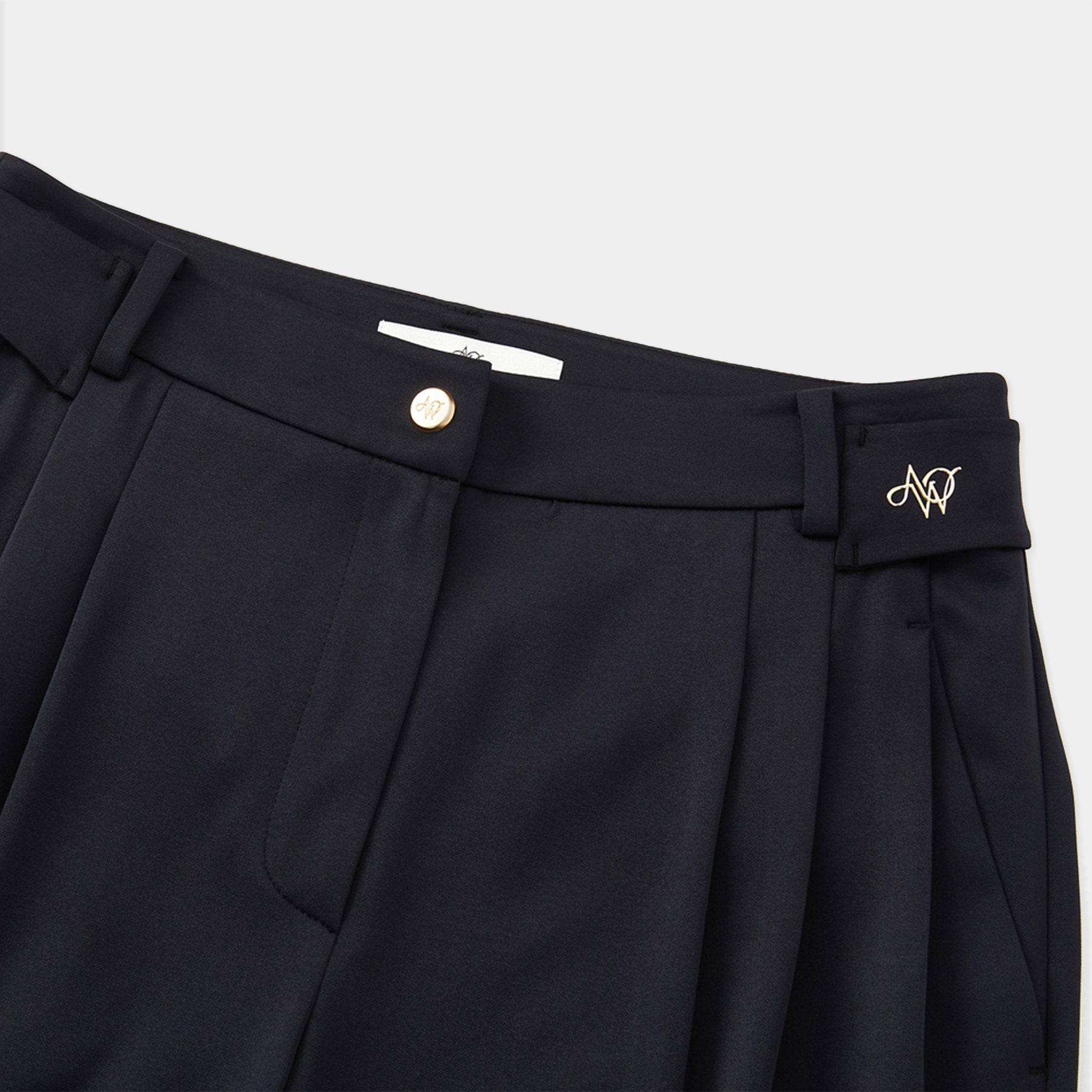 Black pants with a brand logo on a white background