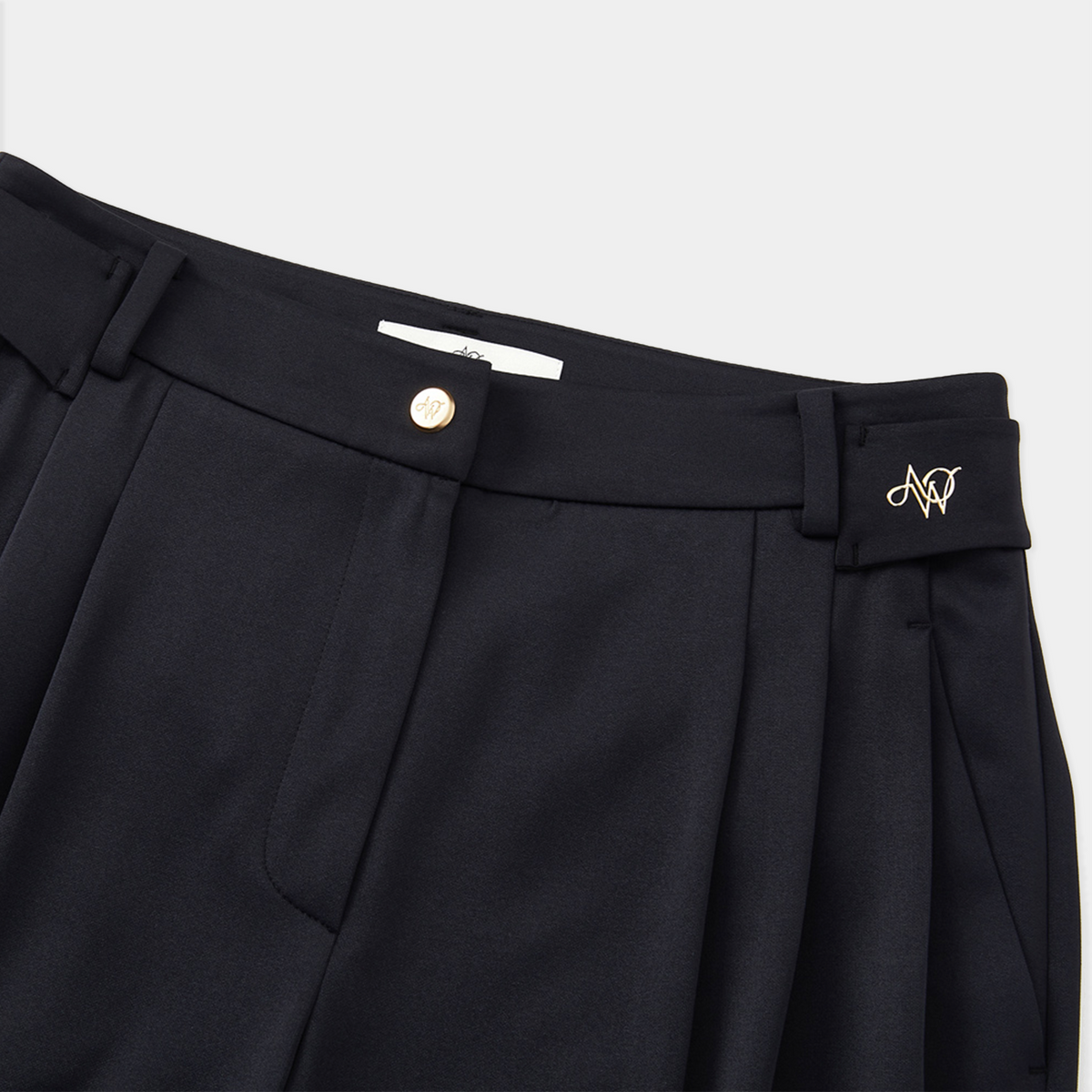 Black pants with a brand logo on a white background