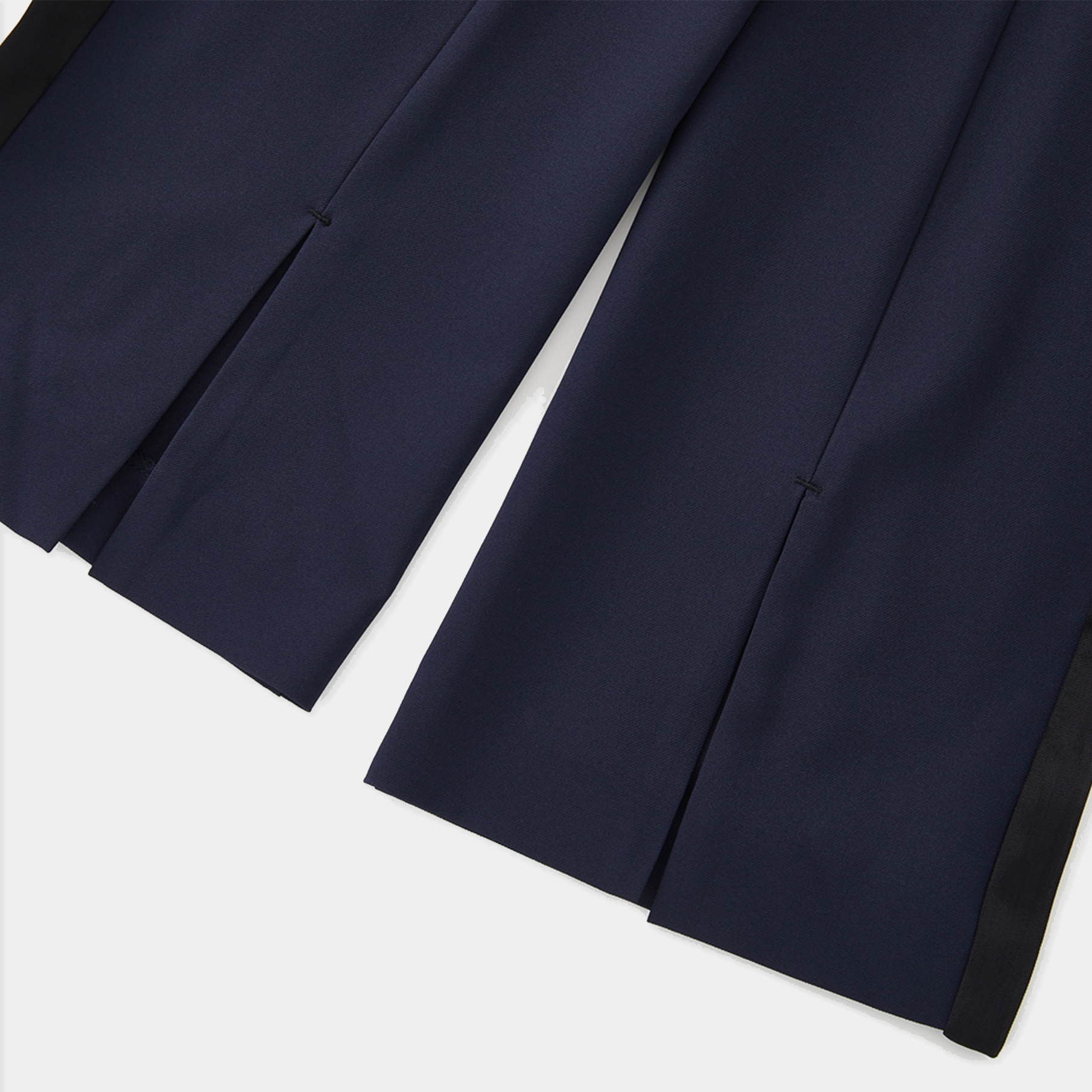 Navy blue pants with a white background