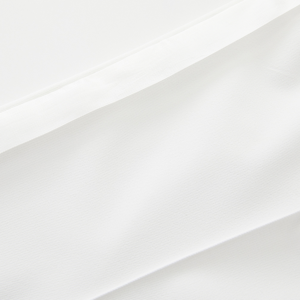 Gradient of white pants on a light gray background
