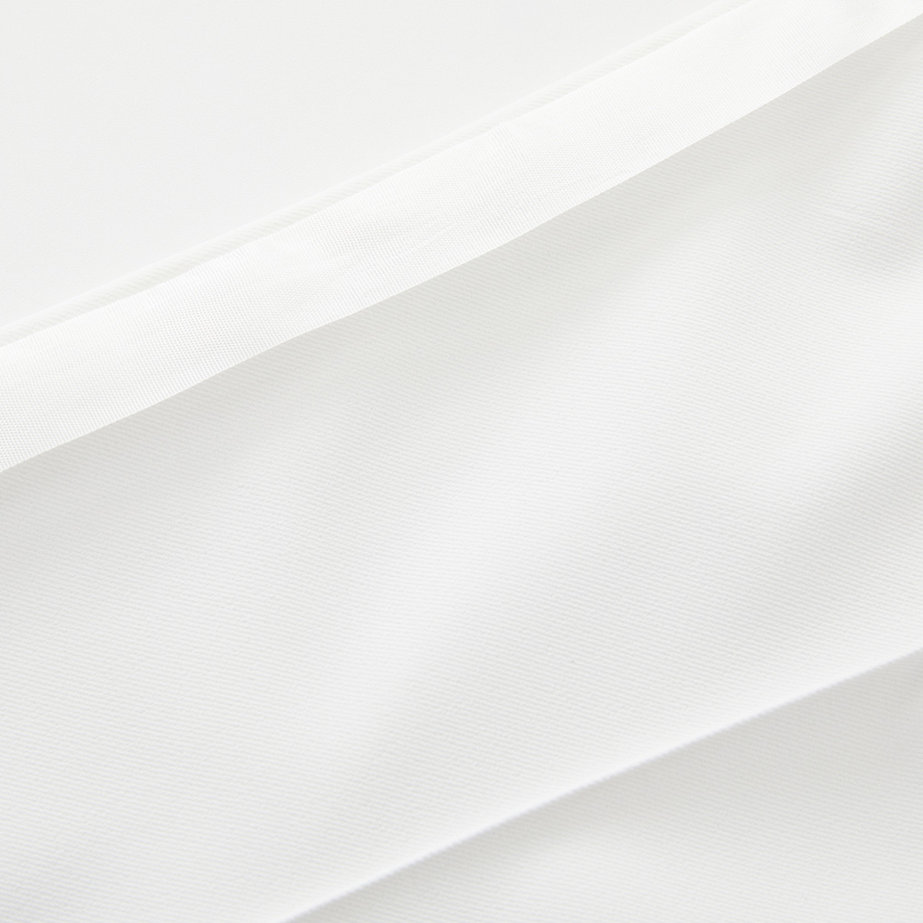 Gradient of white pants on a light gray background